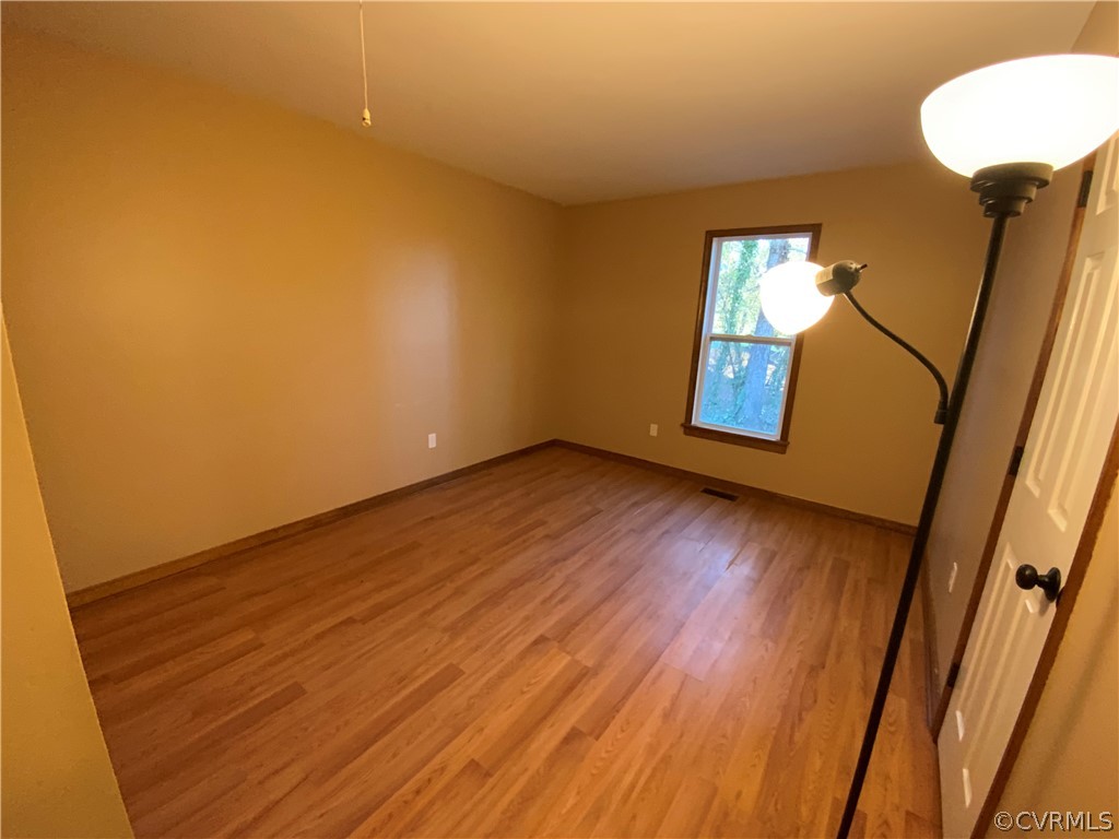 2030 Shallow Well Road Manakin-Sabot, VA 23129 - Photo 17 of 25 a view of empty room with wooden floor