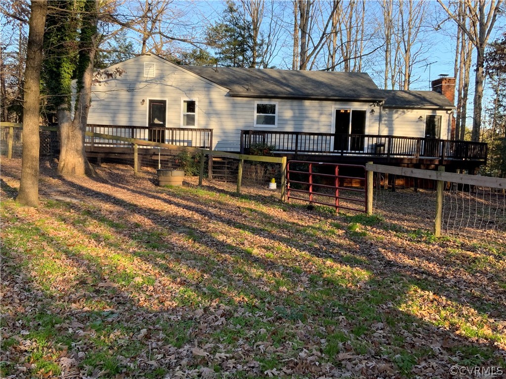 2030 Shallow Well Road Manakin-Sabot, VA 23129 - Photo 9 of 25 a view of a house with a wooden fence next to a yard