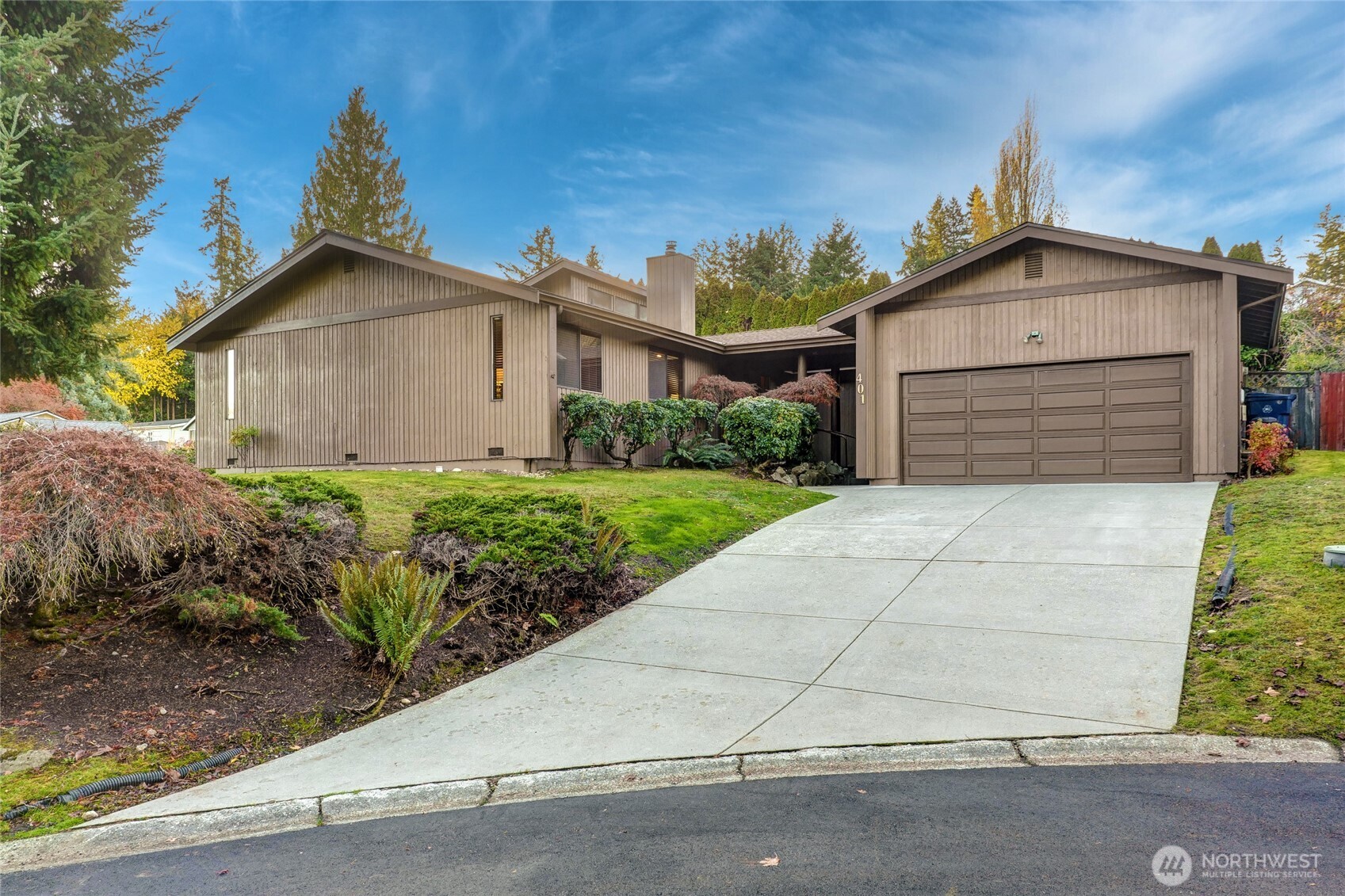 401 169th Street Southeast Bothell, WA 98012 - Photo 1 of 27 a front view of a house with a yard and garage