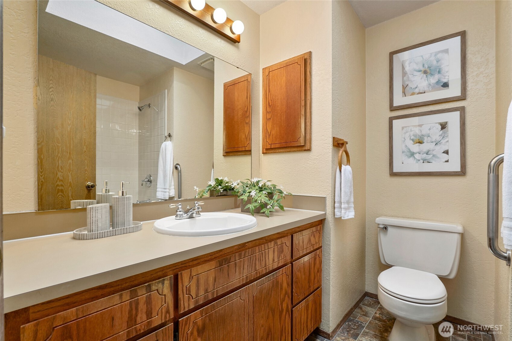 401 169th Street Southeast Bothell, WA 98012 - Photo 19 of 27 a bathroom with a granite countertop toilet sink and a mirror