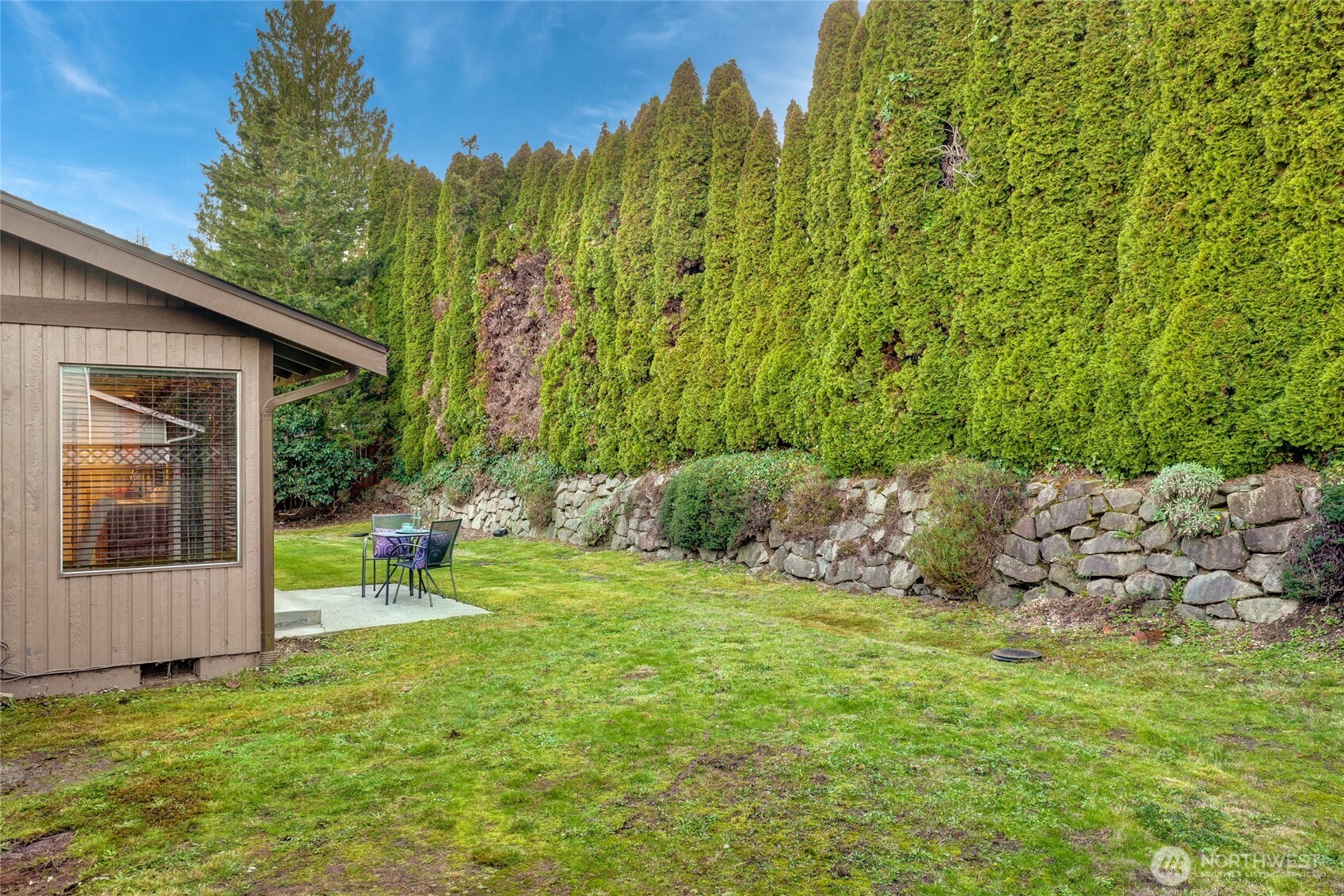 401 169th Street Southeast Bothell, WA 98012 - Photo 27 of 27 a view of a chair and table in backyard of the house