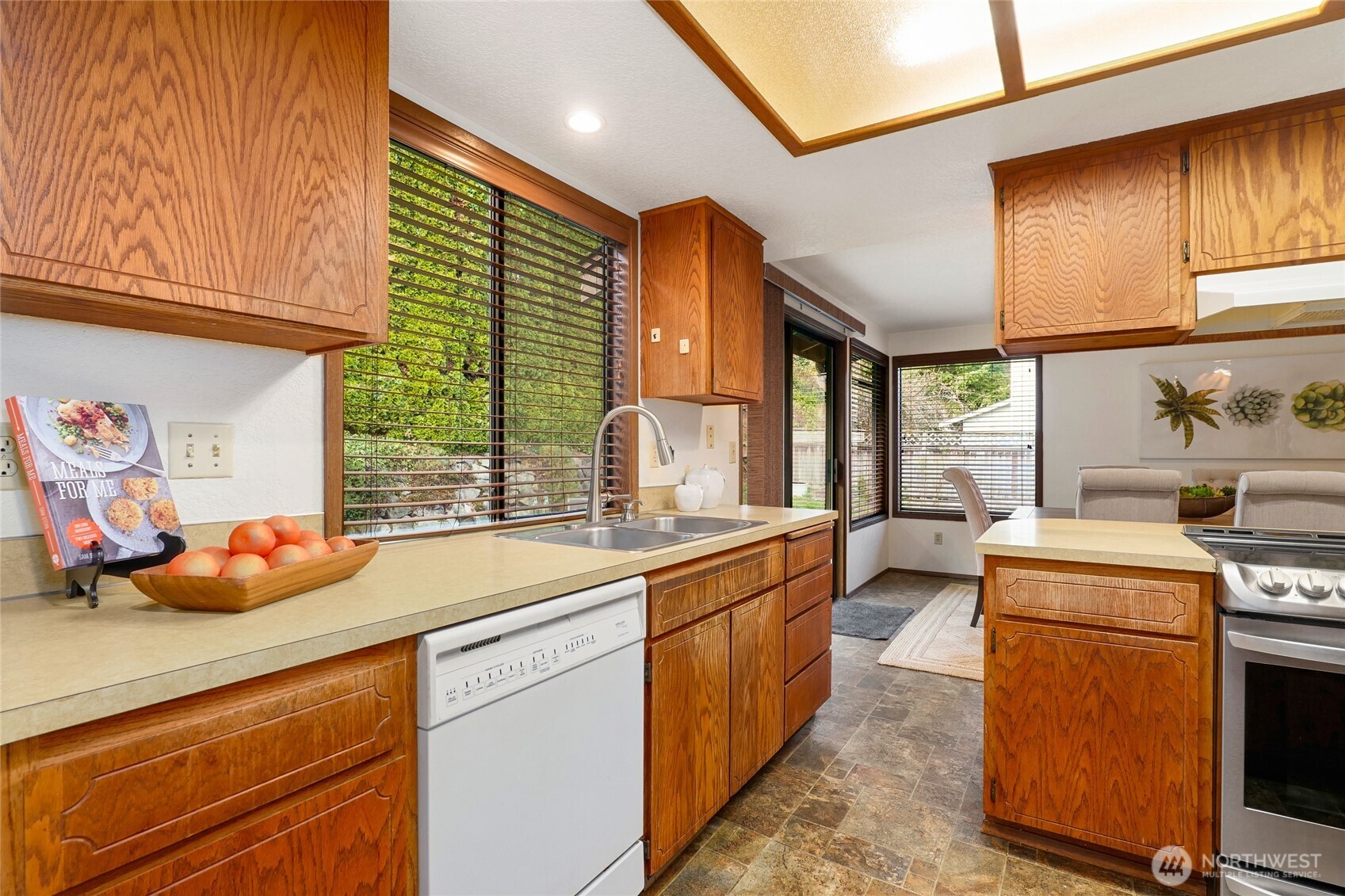 401 169th Street Southeast Bothell, WA 98012 - Photo 8 of 27 a kitchen that has a sink and a stove in it