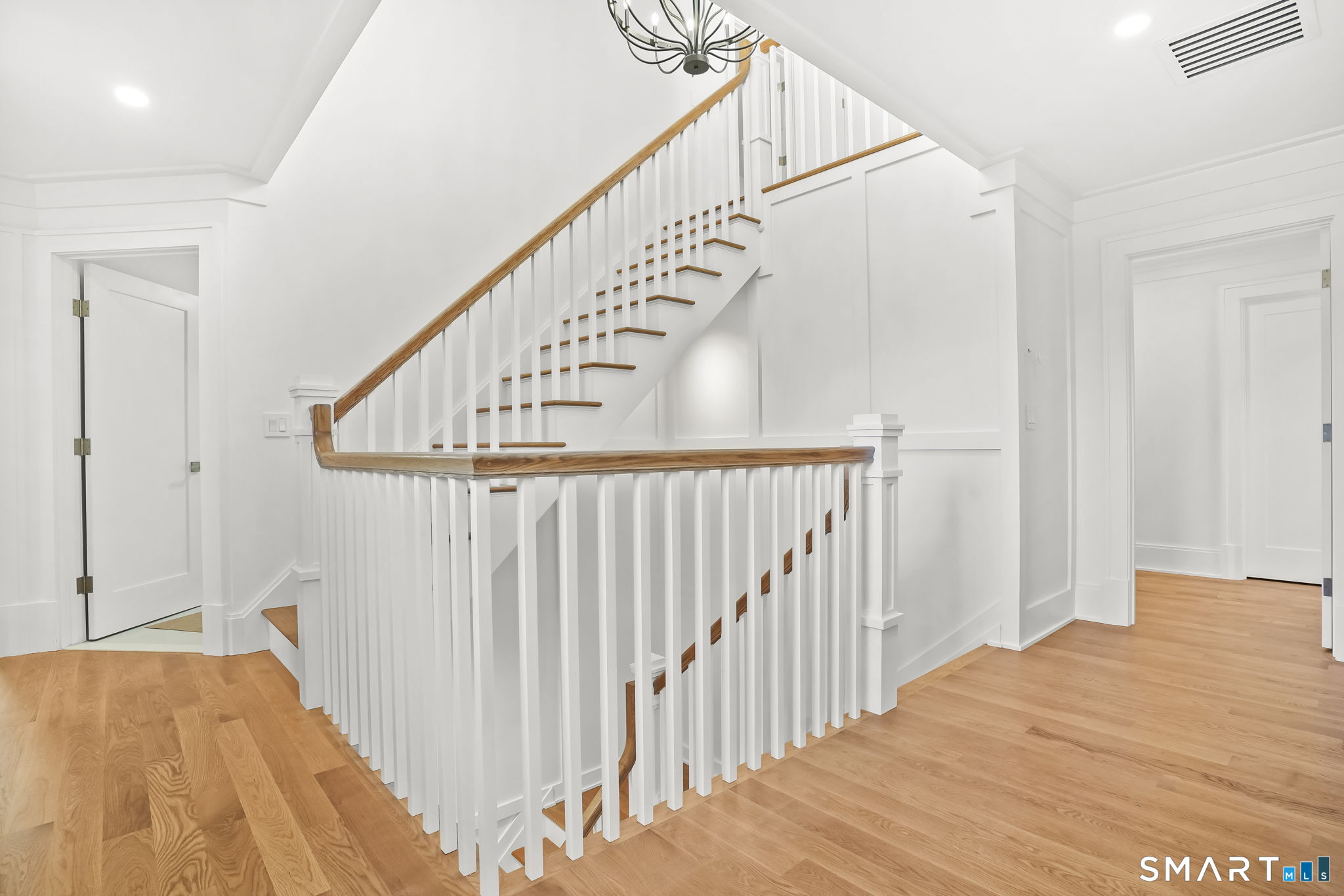 20 Locust Hill Road Darien, CT 06820 - Photo 20 of 30 Open stairway leading to 3rd floor finished space