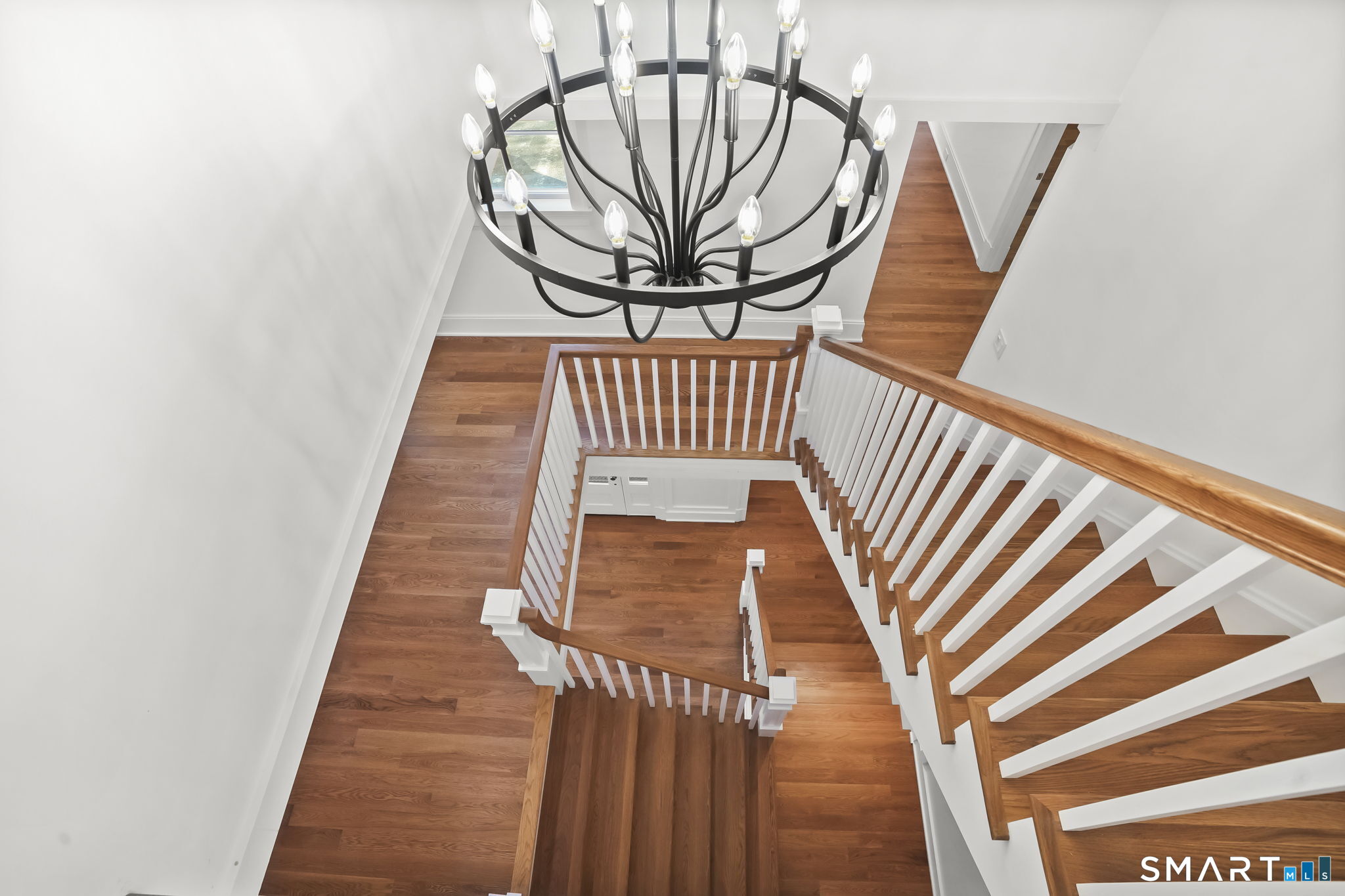 20 Locust Hill Road Darien, CT 06820 - Photo 25 of 30 Open staircase looking down from 3rd floor