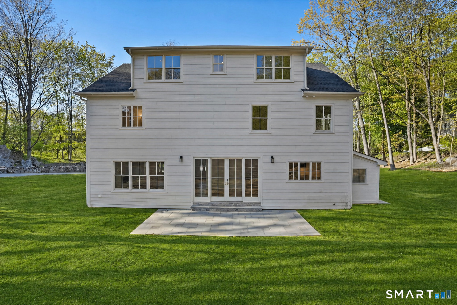 20 Locust Hill Road Darien, CT 06820 - Photo 26 of 30 Rear yard with patio and slider off of kitchen. Grass has been visually enhanced.
