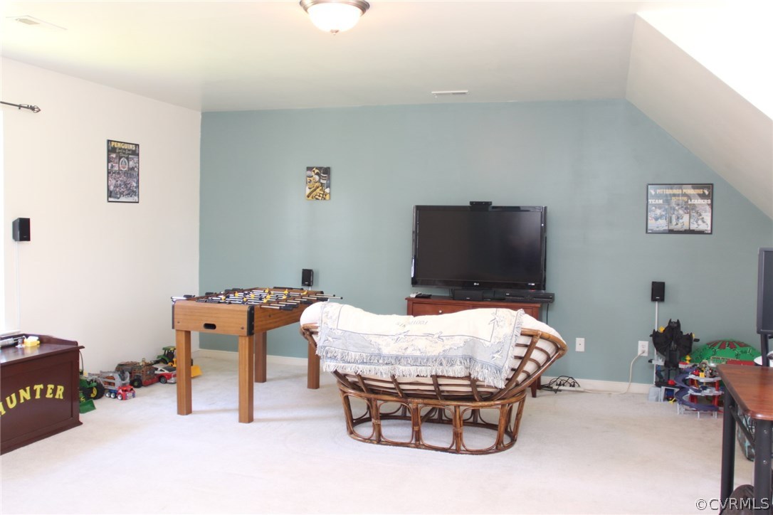 8103 Venable Road Kents Store, VA 23084 - Photo 12 of 23 a room with furniture and a flat screen tv
