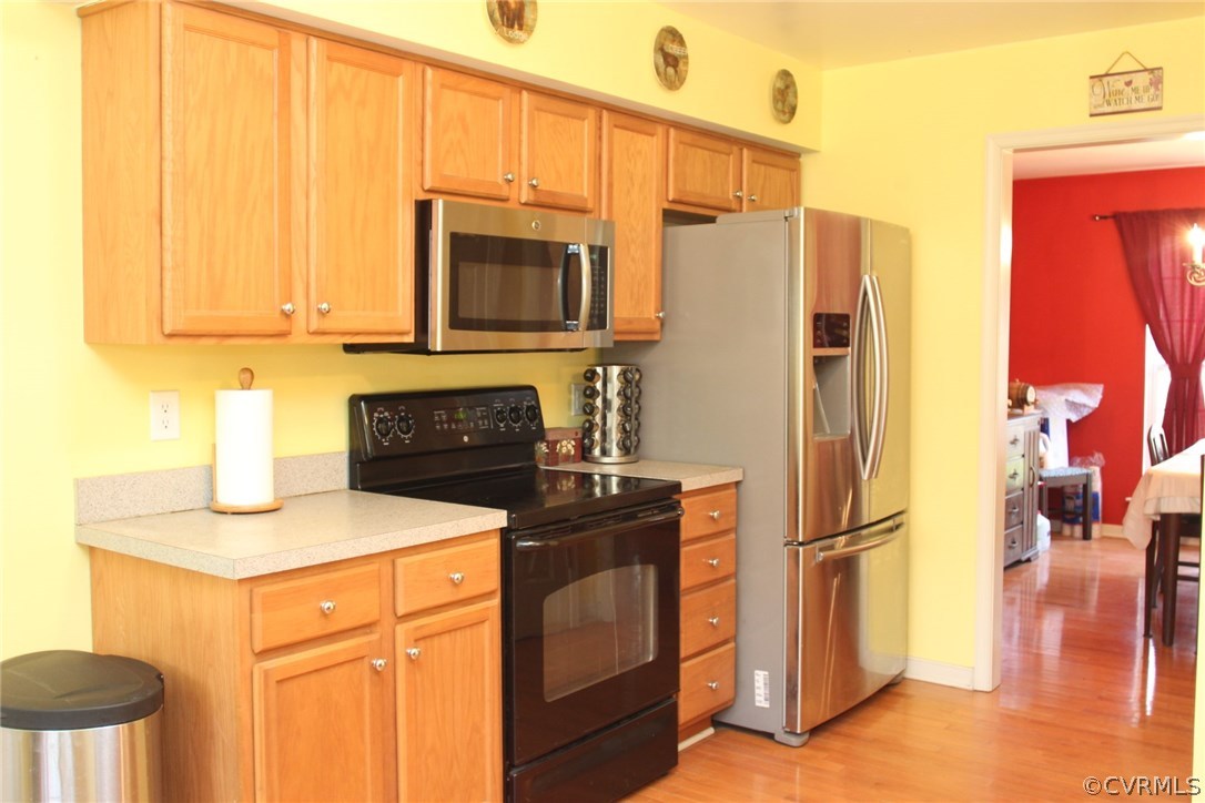 8103 Venable Road Kents Store, VA 23084 - Photo 4 of 23 a kitchen with stainless steel appliances granite countertop a refrigerator stove and microwave