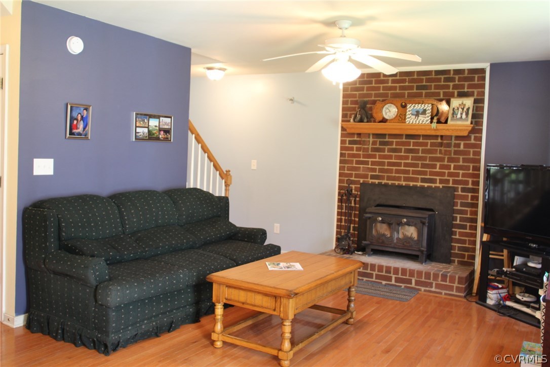 8103 Venable Road Kents Store, VA 23084 - Photo 8 of 23 a living room with furniture a flat screen tv and a fireplace