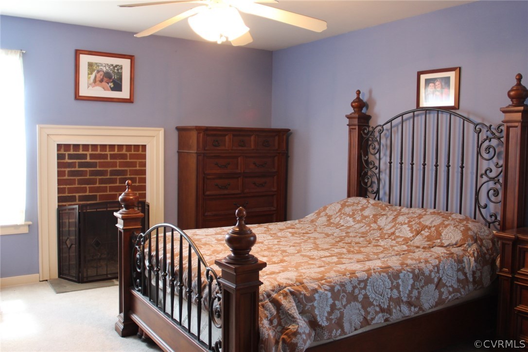 8103 Venable Road Kents Store, VA 23084 - Photo 9 of 23 a bedroom with a bed and a window
