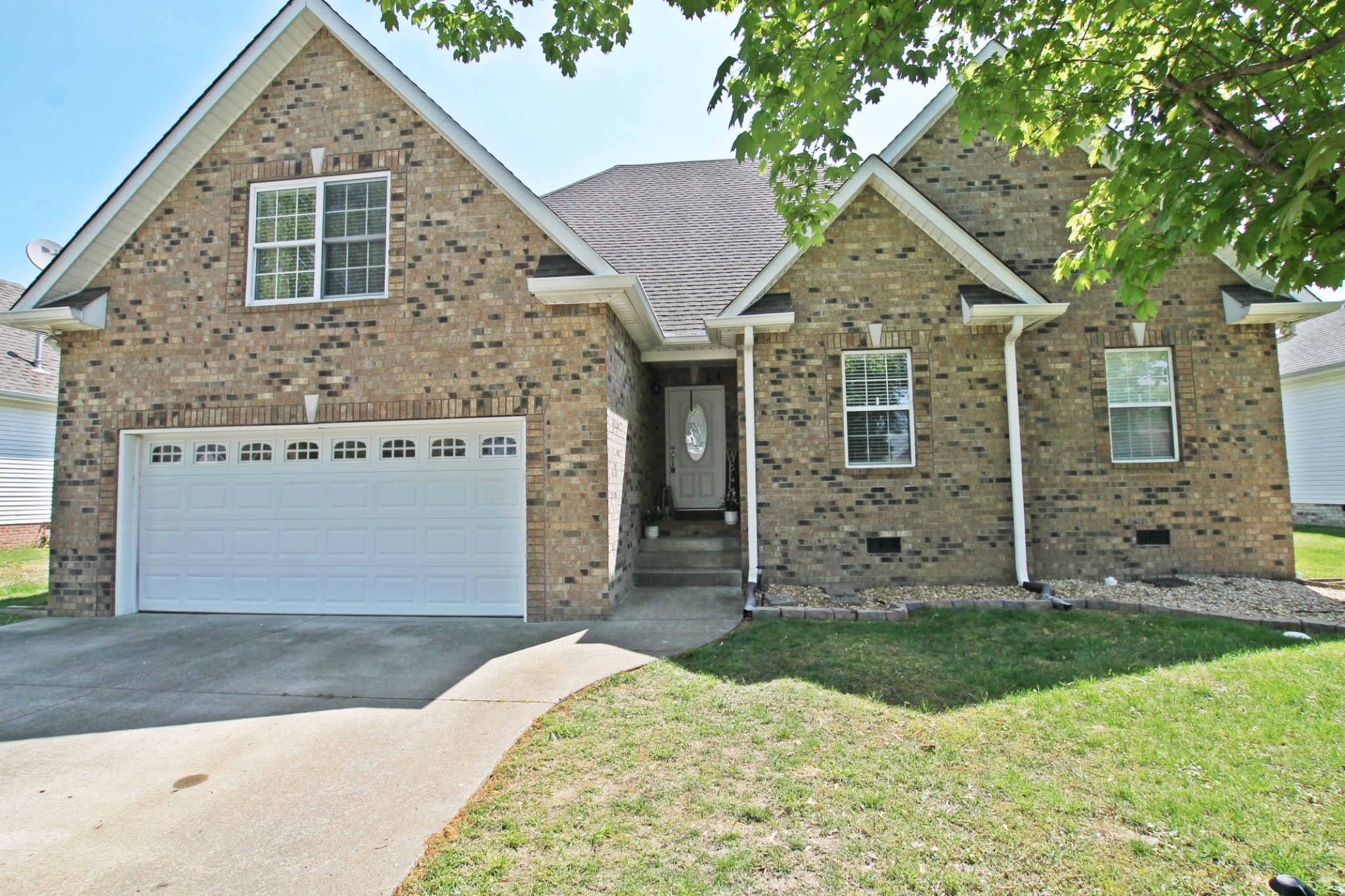 140 Fieldstone Lane Springfield, TN 37172 - Photo 1 of 41 a front view of a house with a yard and garage