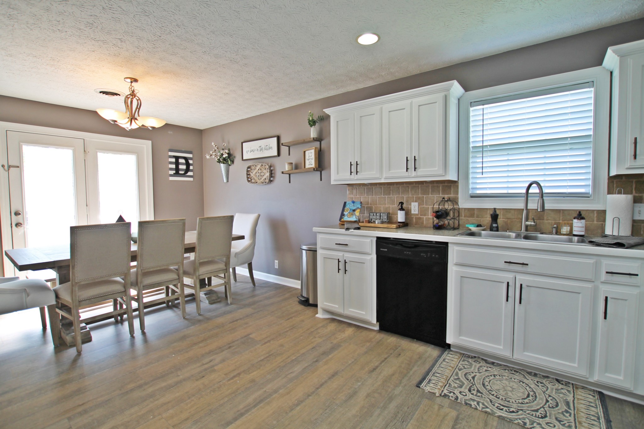 140 Fieldstone Lane Springfield, TN 37172 - Photo 11 of 41 a kitchen with a table chairs sink and cabinets