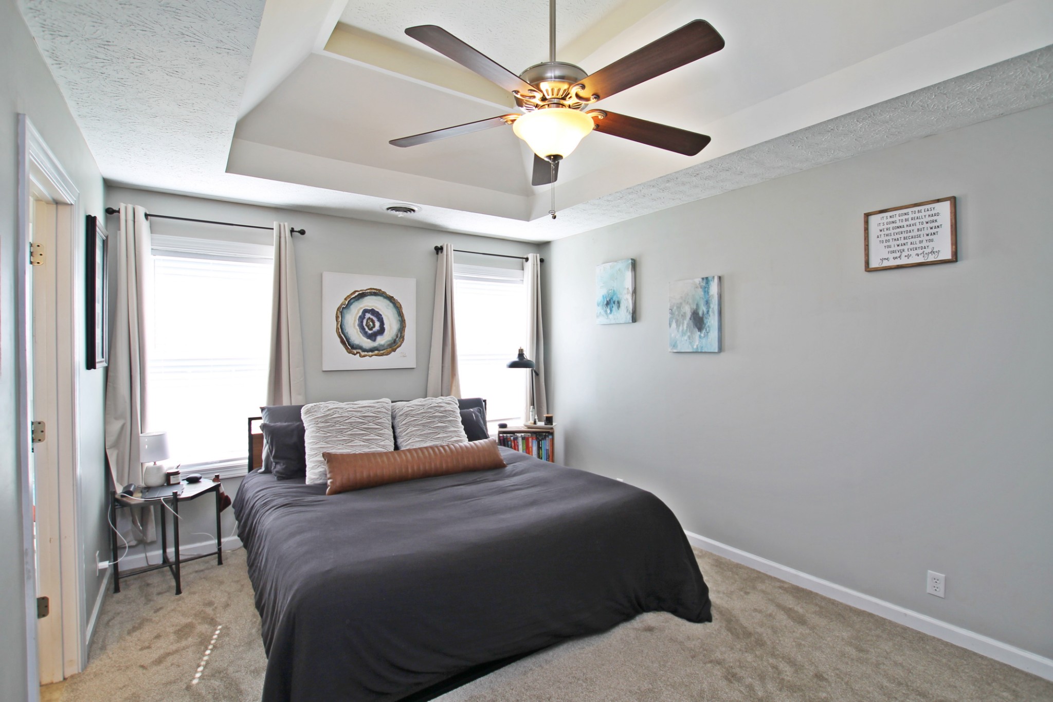 140 Fieldstone Lane Springfield, TN 37172 - Photo 16 of 41 a bedroom with a bed and a chandelier