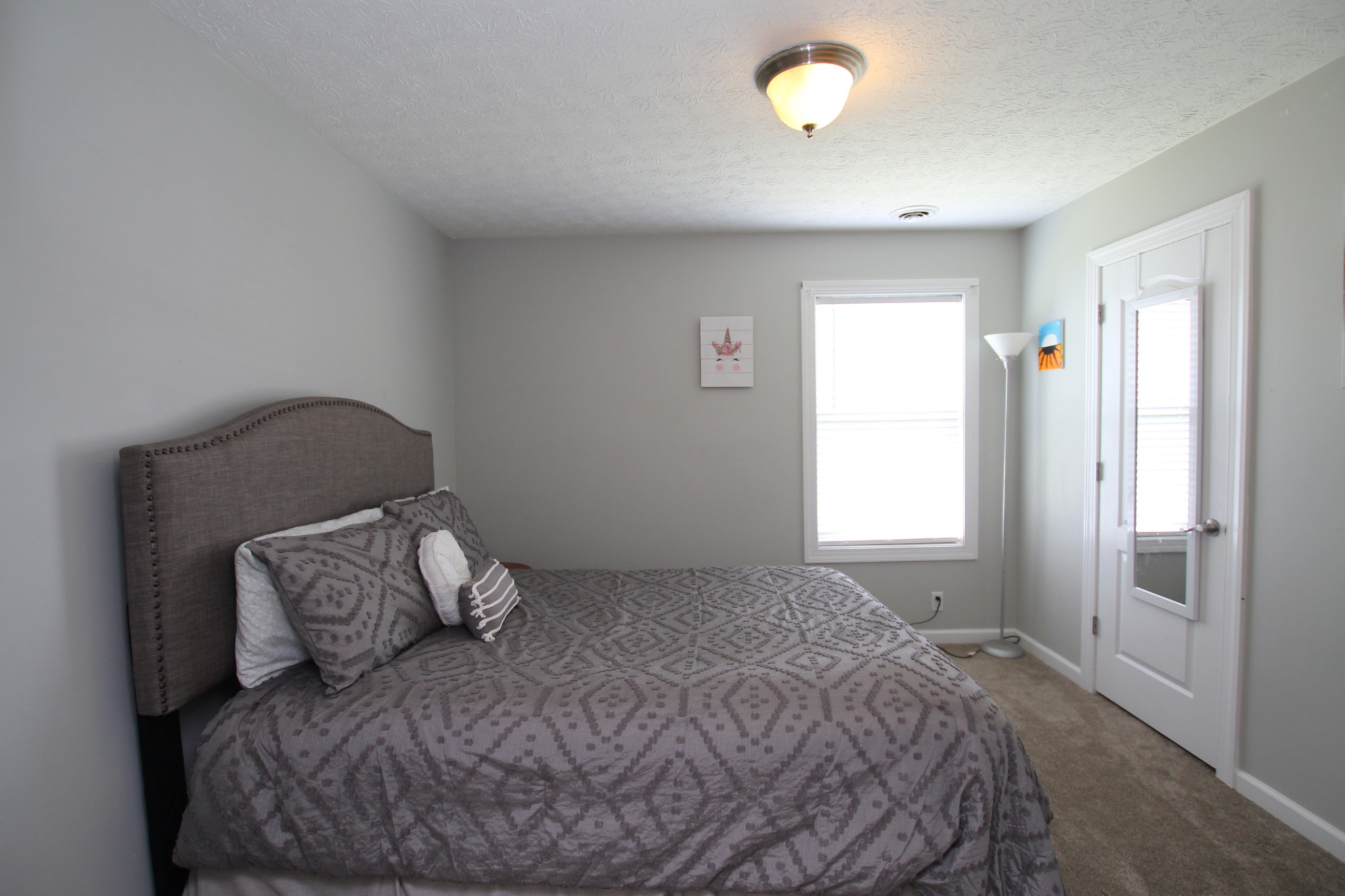 140 Fieldstone Lane Springfield, TN 37172 - Photo 23 of 41 a bed sitting in a bedroom next to a window