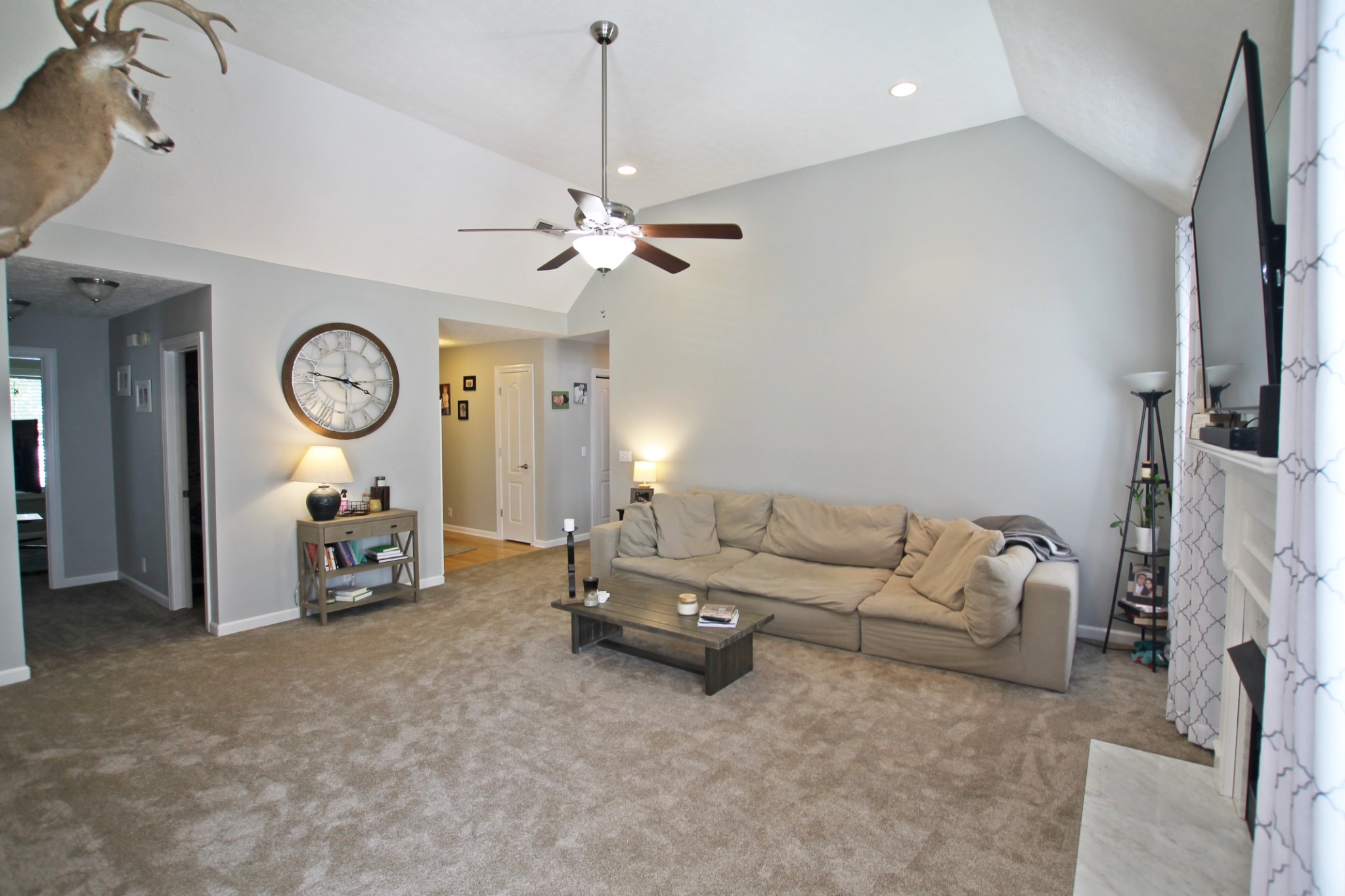 140 Fieldstone Lane Springfield, TN 37172 - Photo 4 of 41 a living room with furniture a clock and a ceiling fan