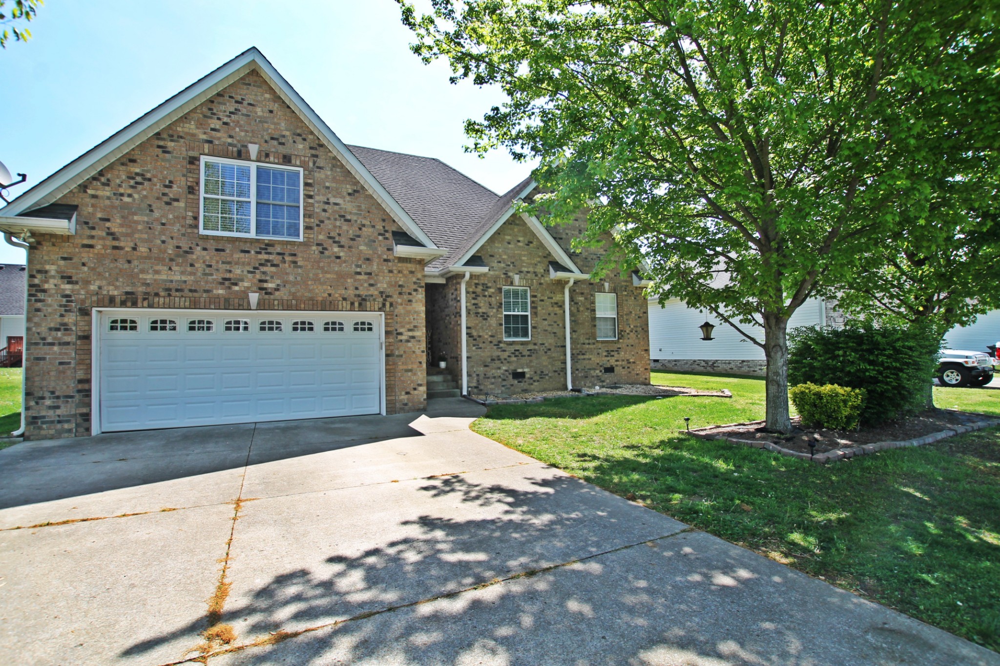 140 Fieldstone Lane Springfield, TN 37172 - Photo 34 of 41 a front view of a house with a yard and garage