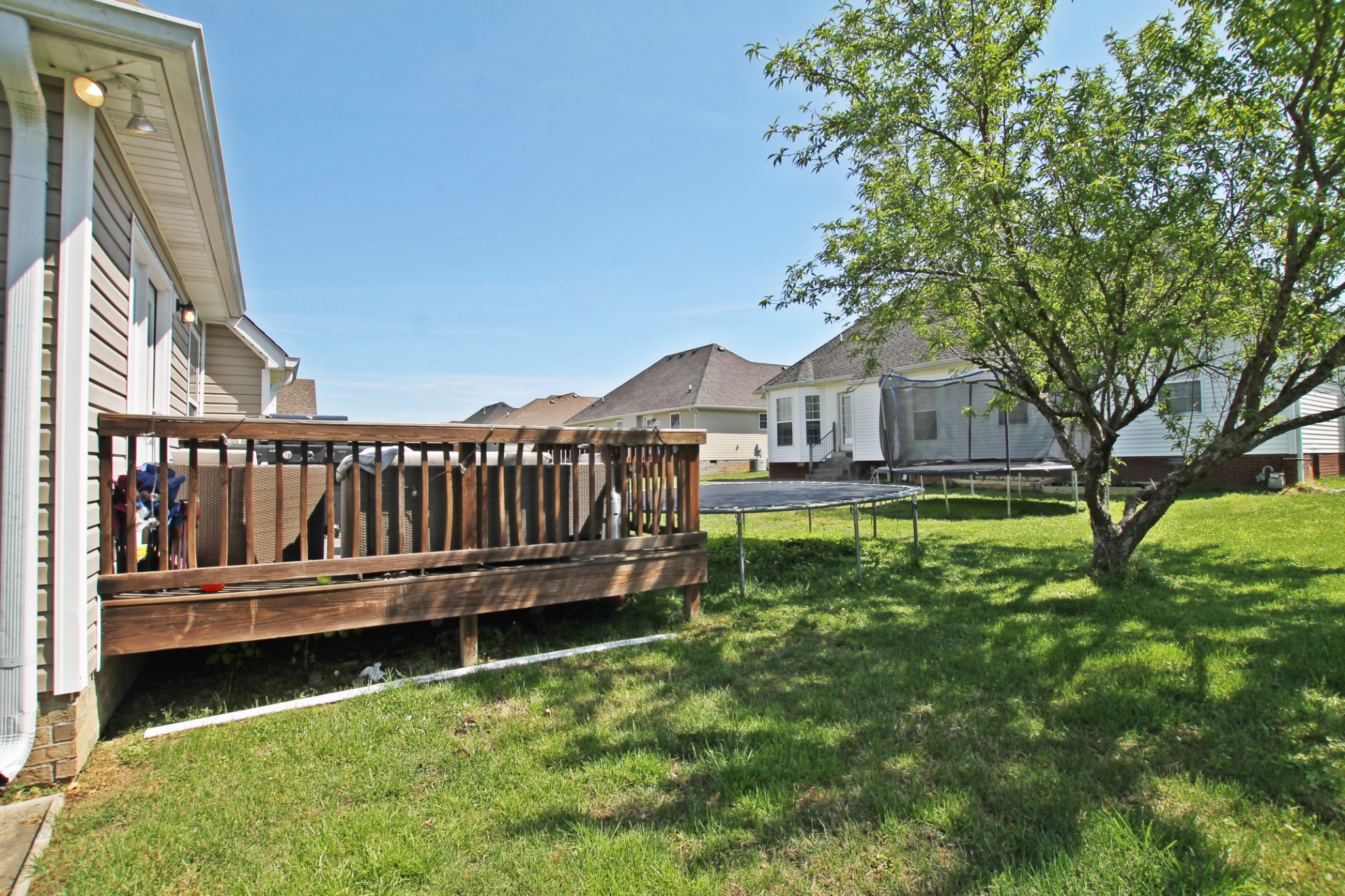 140 Fieldstone Lane Springfield, TN 37172 - Photo 38 of 41 a view of a house with a yard deck and a small yard