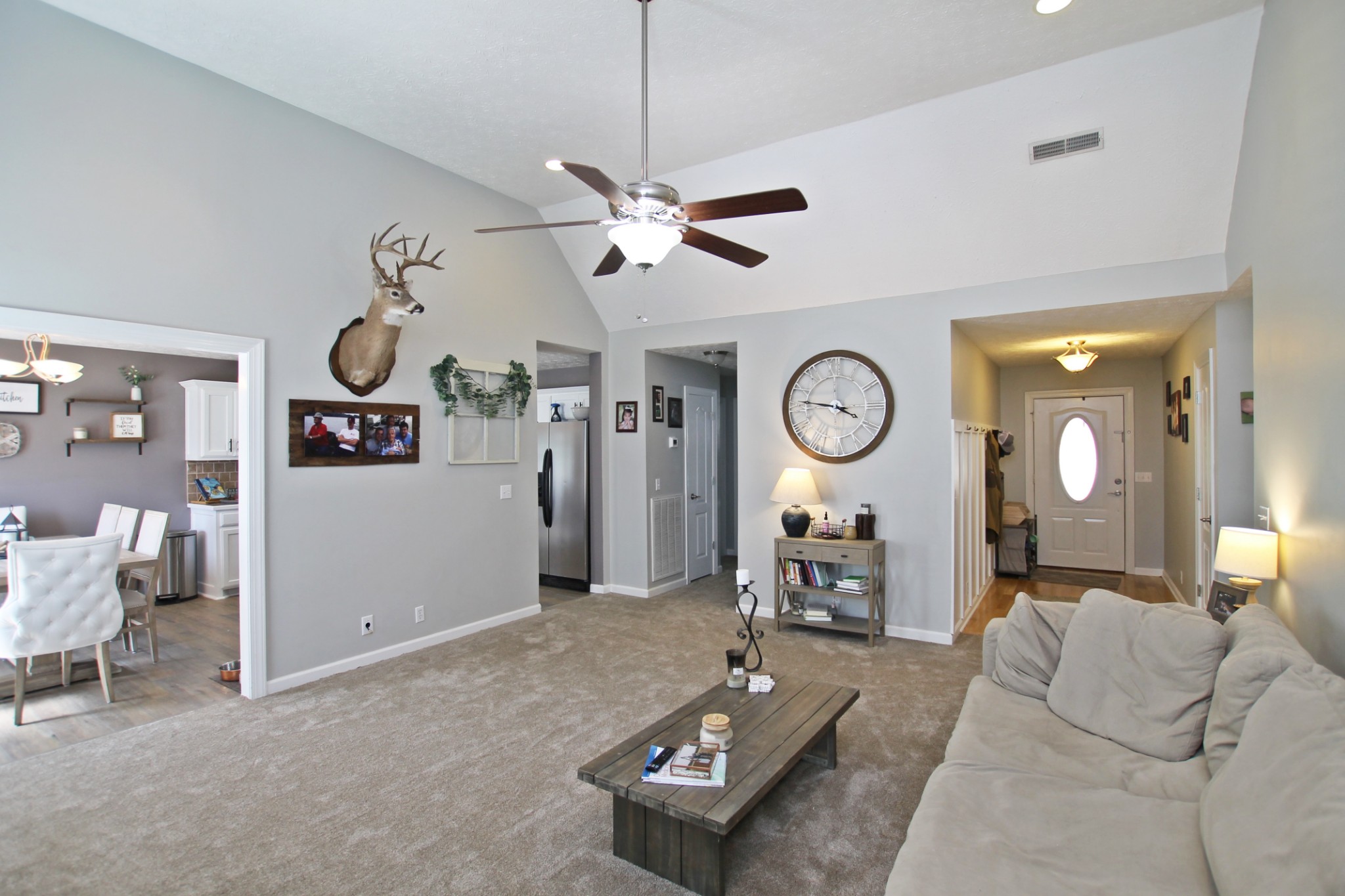 140 Fieldstone Lane Springfield, TN 37172 - Photo 6 of 41 a living room with furniture a clock and a chandelier