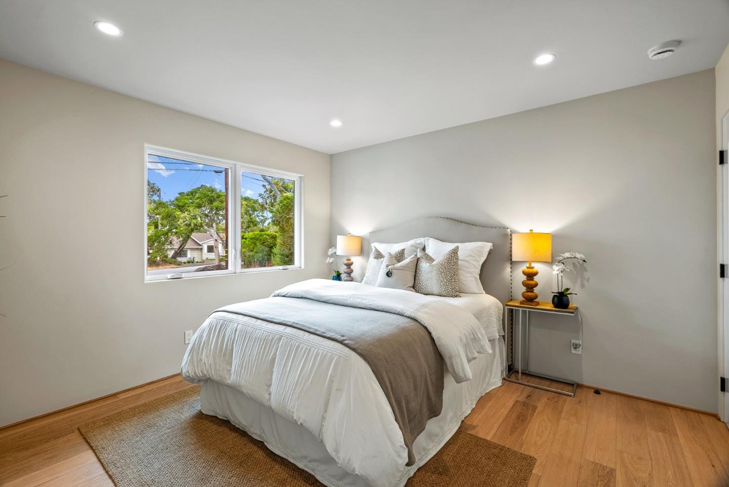 2869 Forest Lodge Road Pebble Beach, CA 93953 - Photo 15 of 34 a bedroom with a bed and window