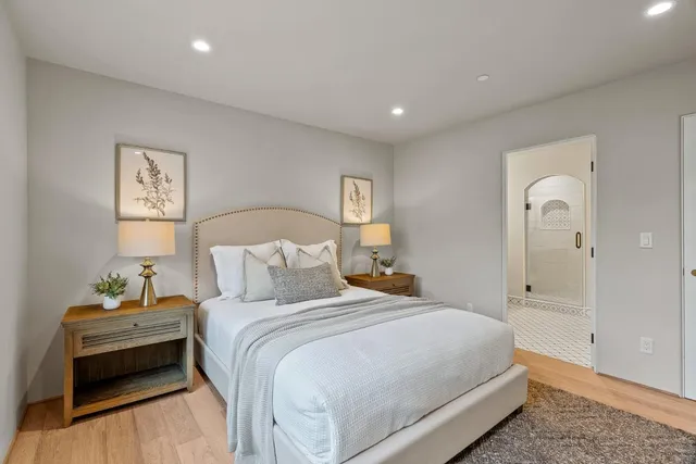 a bedroom with a bed and a lamp