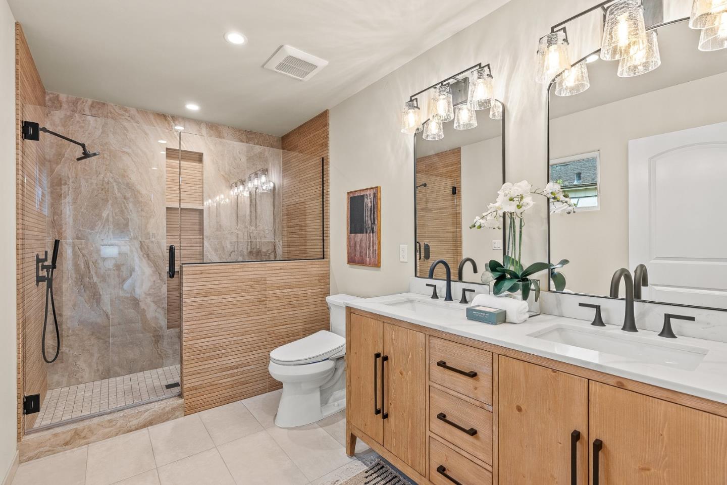 2869 Forest Lodge Road Pebble Beach, CA 93953 - Photo 23 of 34 a bathroom with a double vanity sink toilet and shower