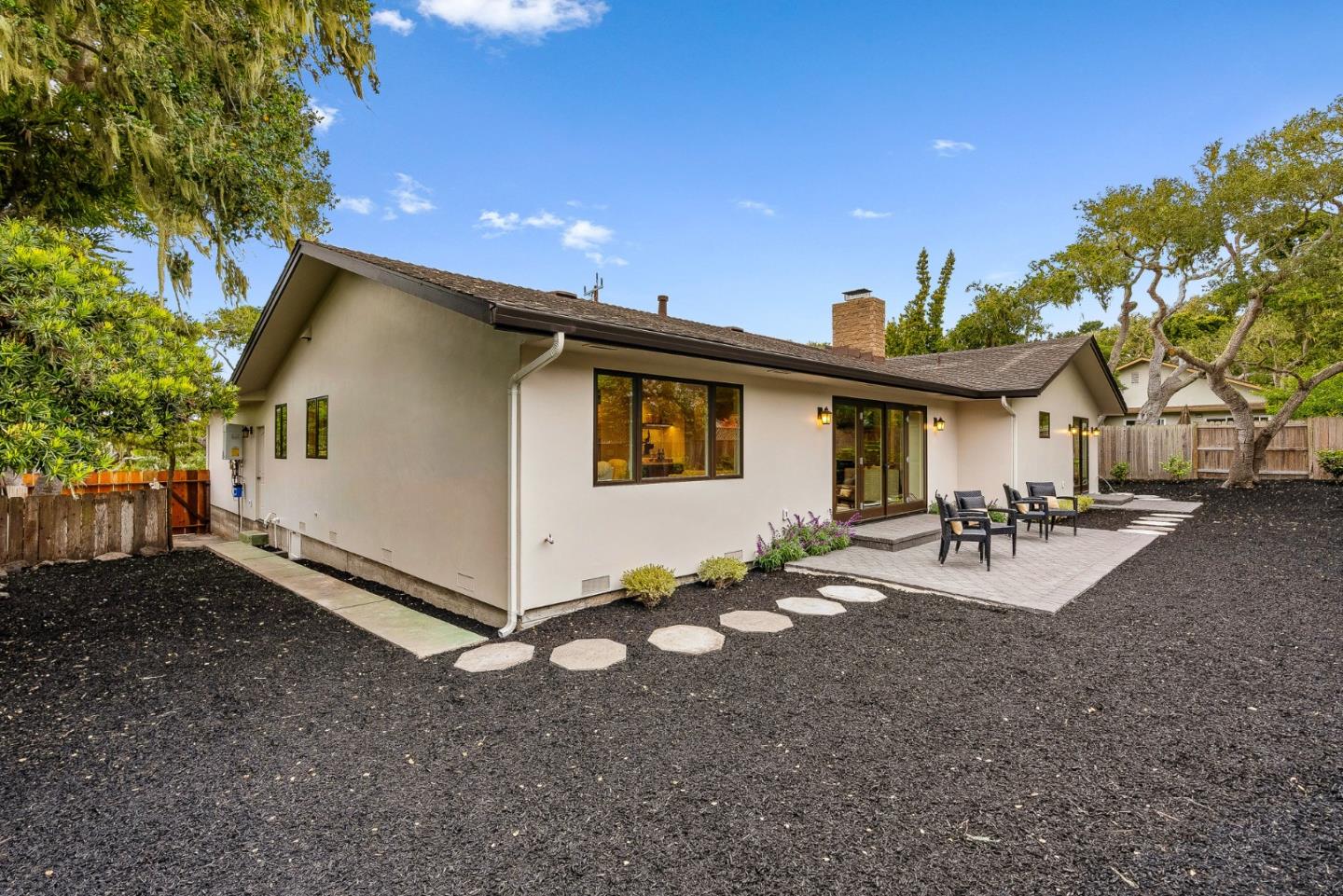 2869 Forest Lodge Road Pebble Beach, CA 93953 - Photo 32 of 34 a view of a house with backyard and sitting area