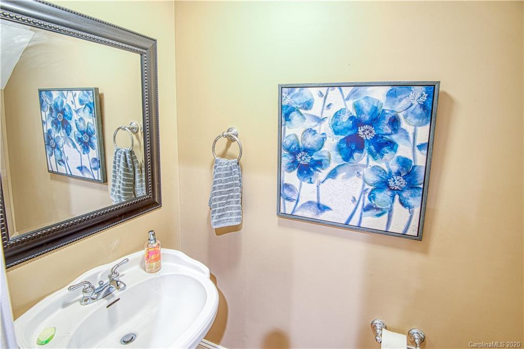 3224 Fifth Baxter Crossing Fort Mill, SC 29708 - Photo 13 of 41 a bathroom with a sink and a mirror
