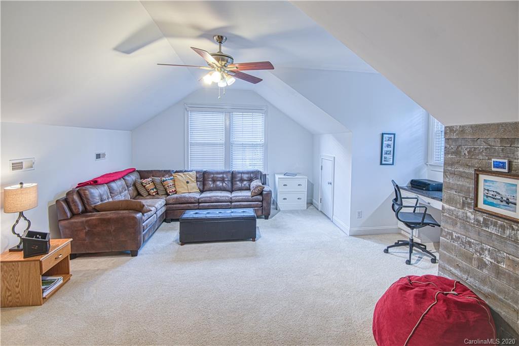 3224 Fifth Baxter Crossing Fort Mill, SC 29708 - Photo 14 of 41 a living room with furniture and a chandelier