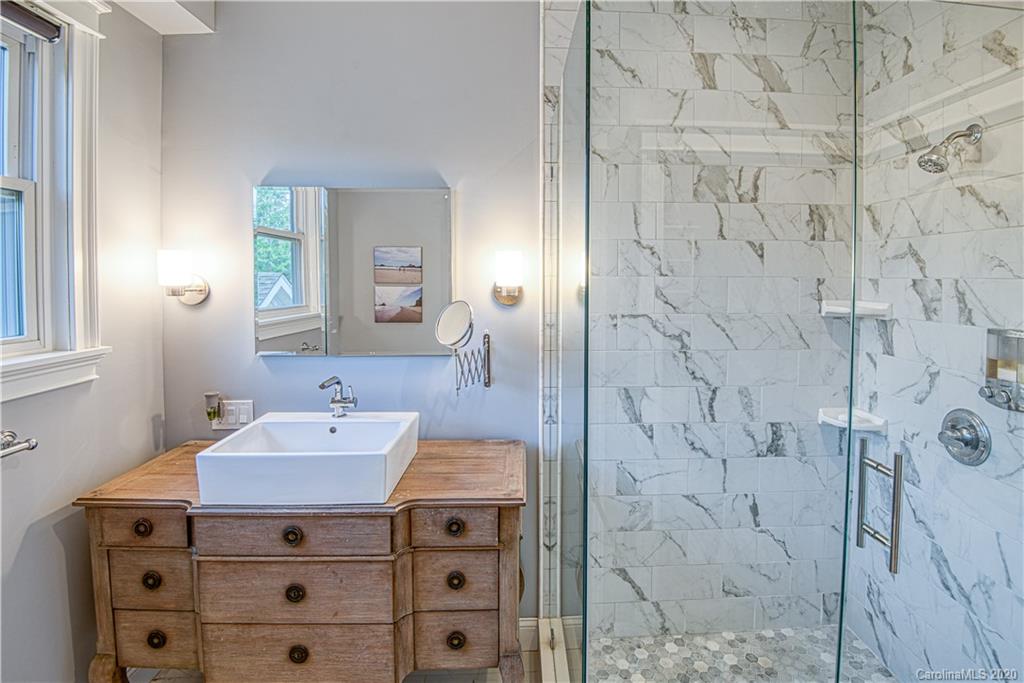 3224 Fifth Baxter Crossing Fort Mill, SC 29708 - Photo 19 of 41 a bathroom with a sink vanity granite and shower