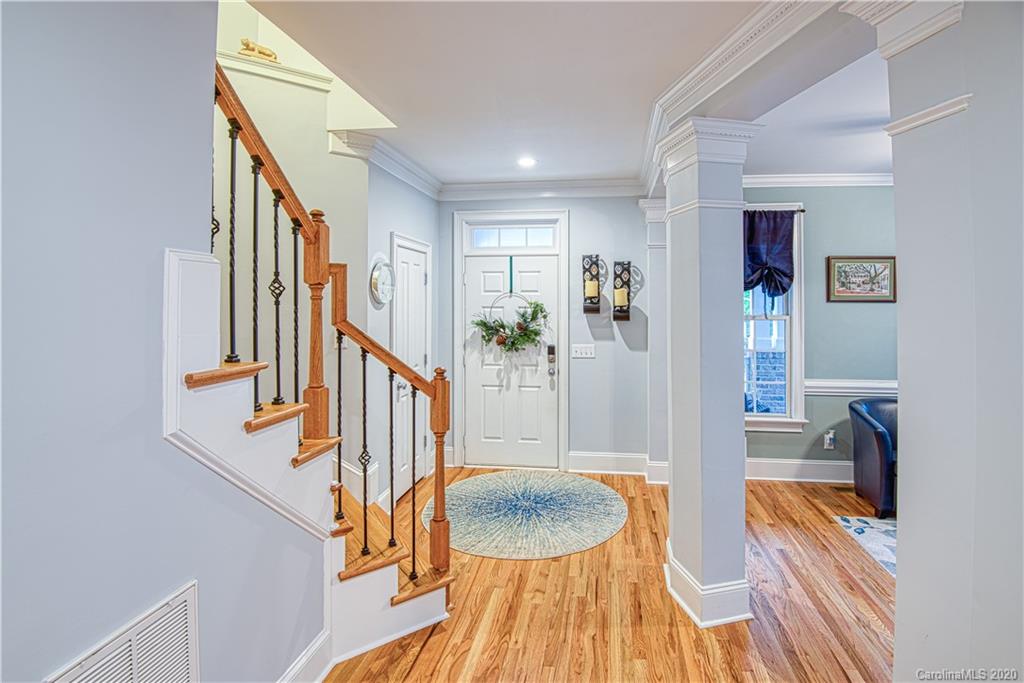 3224 Fifth Baxter Crossing Fort Mill, SC 29708 - Photo 6 of 41 a view of entryway and hall with wooden floor