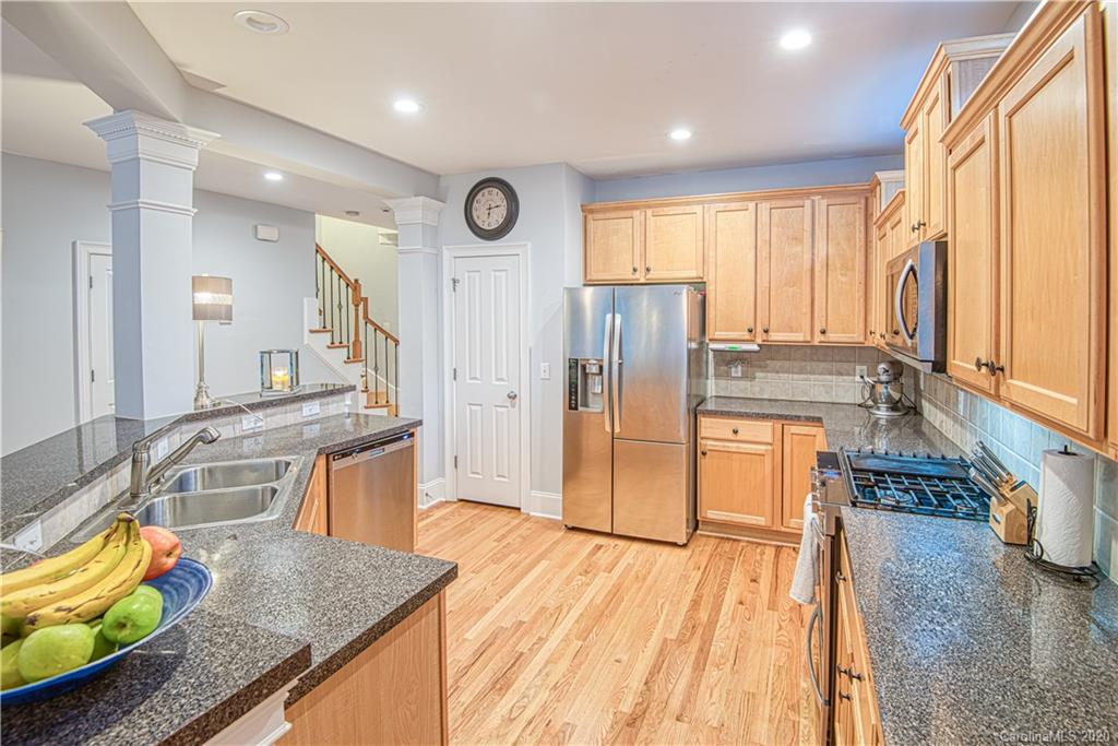 3224 Fifth Baxter Crossing Fort Mill, SC 29708 - Photo 8 of 41 a kitchen with stainless steel appliances granite countertop a refrigerator a stove top oven and a sink with granite countertops
