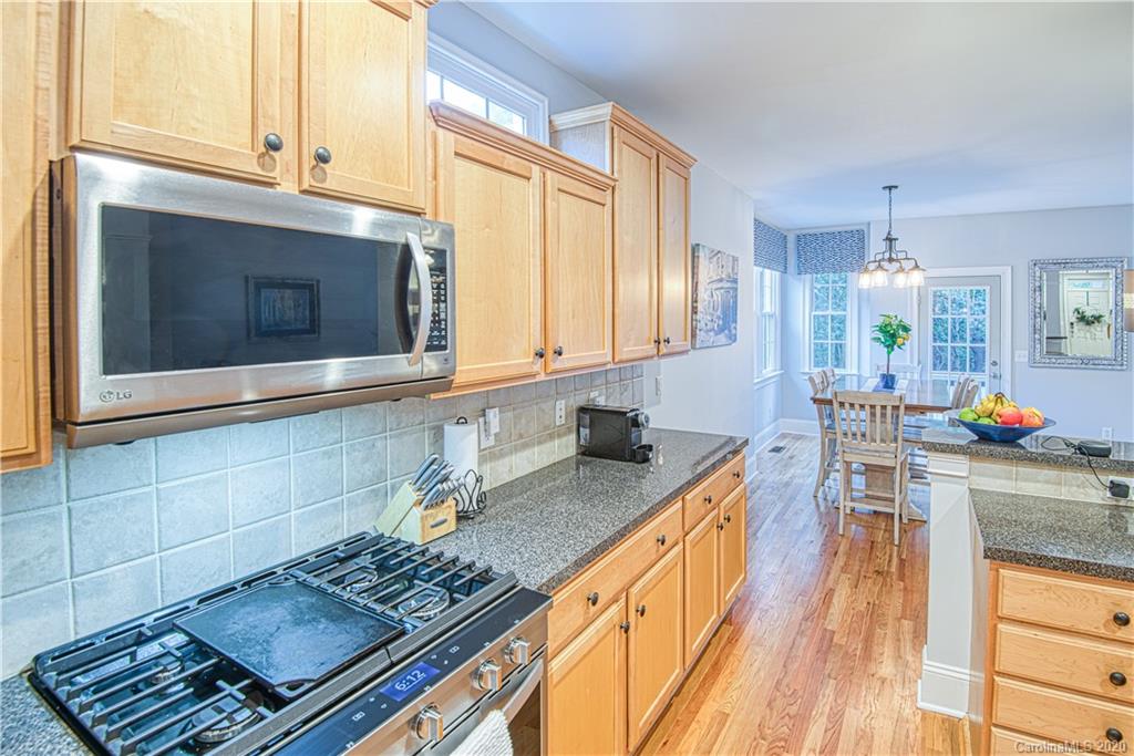 3224 Fifth Baxter Crossing Fort Mill, SC 29708 - Photo 9 of 41 a kitchen with stainless steel appliances granite countertop a stove and a sink