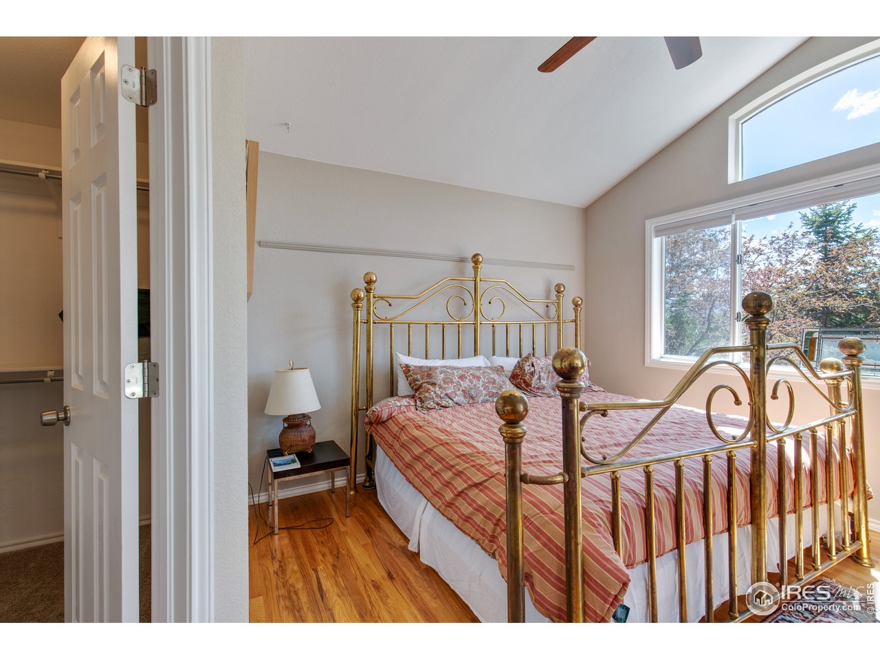 5635 Quarry Court Boulder, CO 80301 - Photo 11 of 28 a bedroom with a bed a two couches and large windows