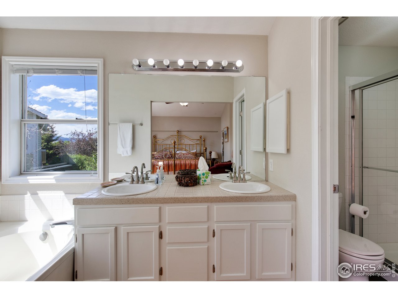 5635 Quarry Court Boulder, CO 80301 - Photo 15 of 28 a bathroom with a sink double vanity and a mirror