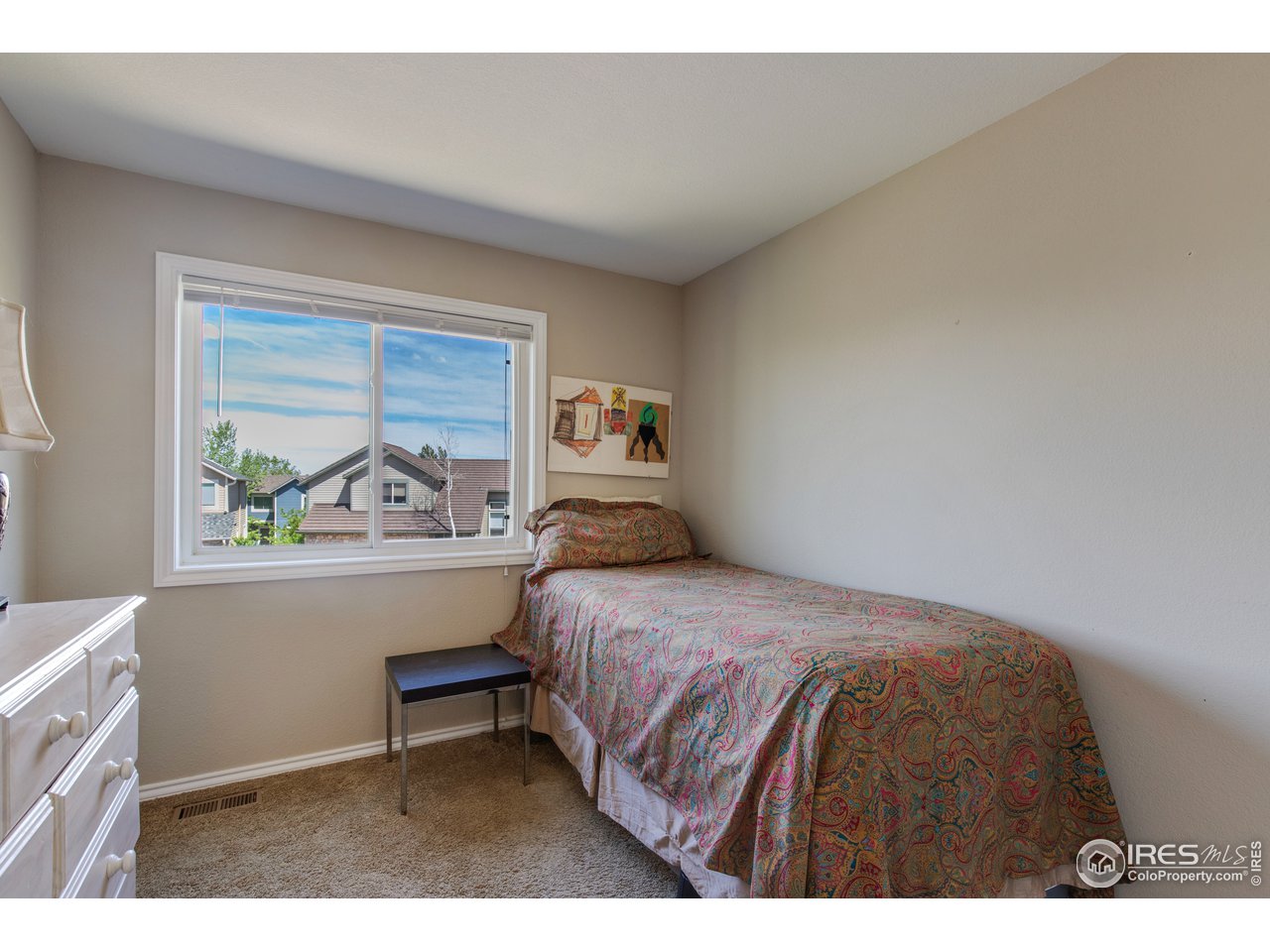 5635 Quarry Court Boulder, CO 80301 - Photo 18 of 28 a bedroom with a bed and a window