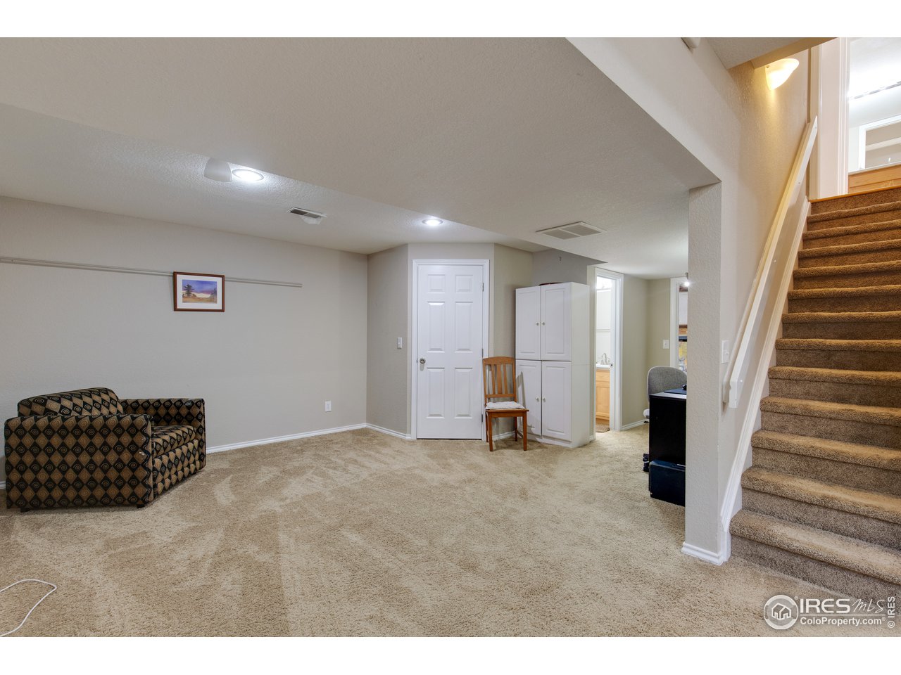 5635 Quarry Court Boulder, CO 80301 - Photo 22 of 28 a view of an empty room with stairs