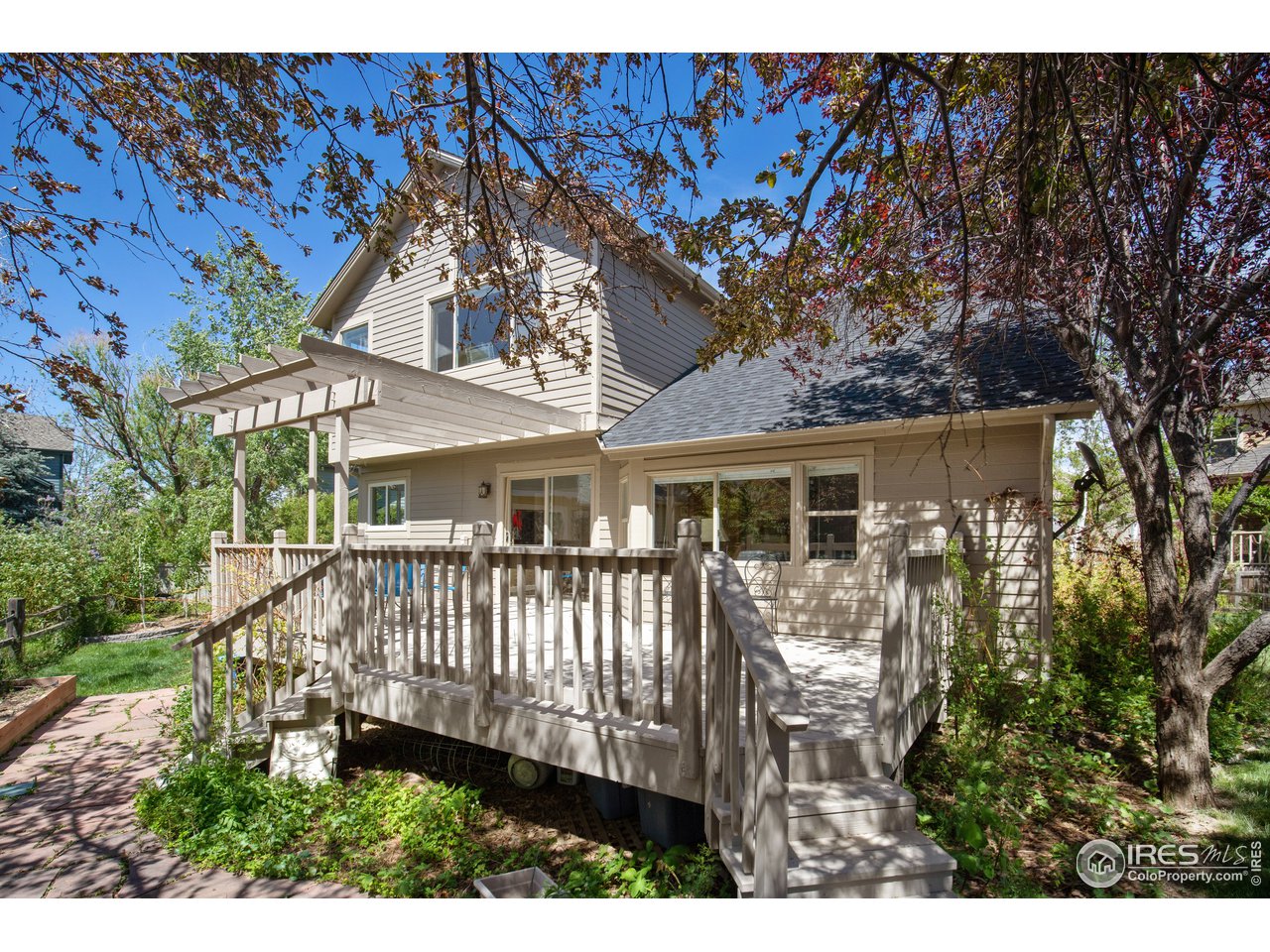 5635 Quarry Court Boulder, CO 80301 - Photo 27 of 28 a front view of a house with a garden