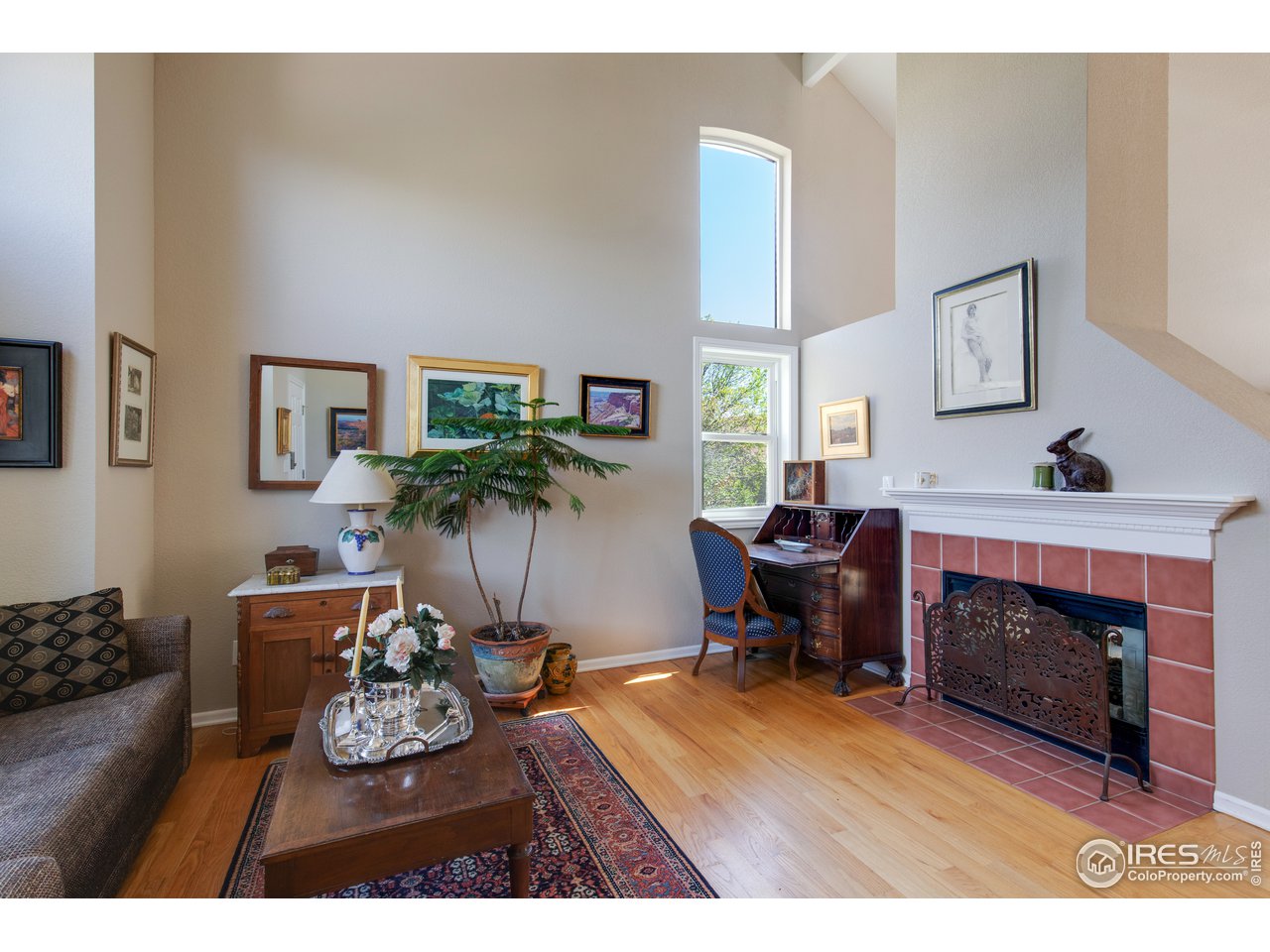 5635 Quarry Court Boulder, CO 80301 - Photo 4 of 28 a living room with furniture a window and a fireplace
