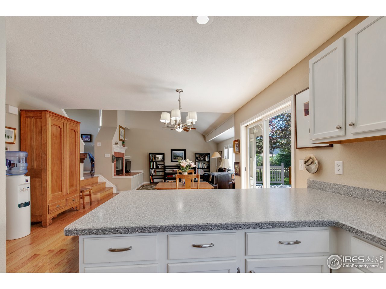 5635 Quarry Court Boulder, CO 80301 - Photo 9 of 28 a living room with stainless steel appliances kitchen island granite countertop furniture and a kitchen view