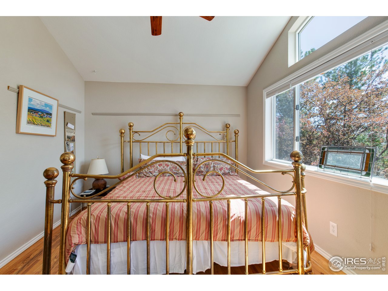 5635 Quarry Court Boulder, CO 80301 - Photo 10 of 28 a bedroom with a bed and a window