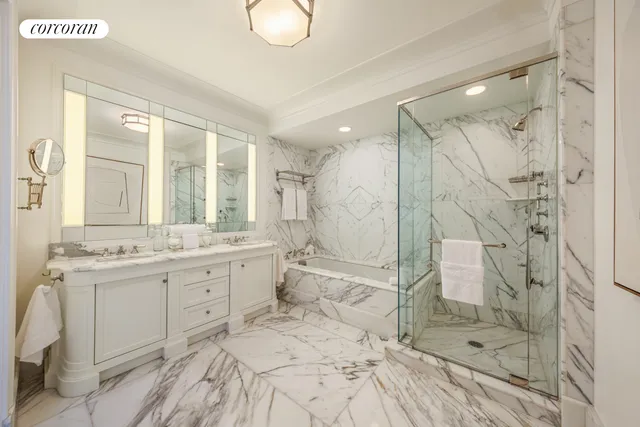 a spacious bathroom with a shower sink and mirror