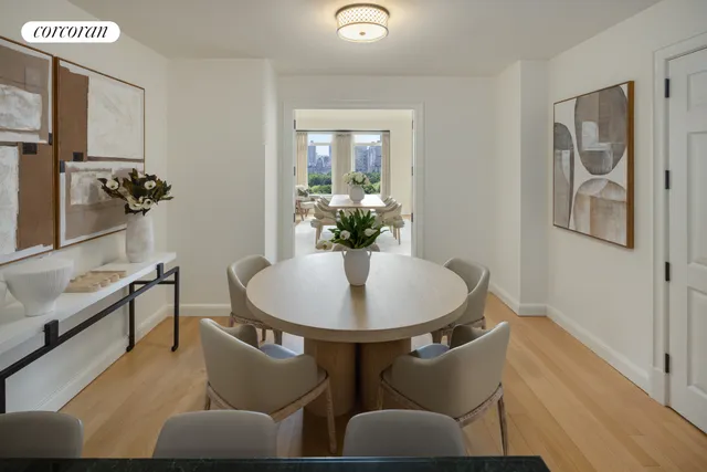 a living room with stainless steel appliances kitchen island granite countertop a stove and a view of living room