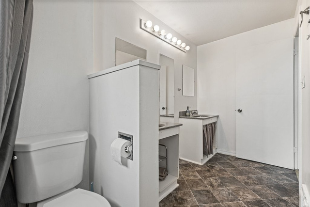 149 West 1600th Street South Mapleton, UT 84664 - Photo 25 of 44 Bathroom featuring vanity and stone finish floors