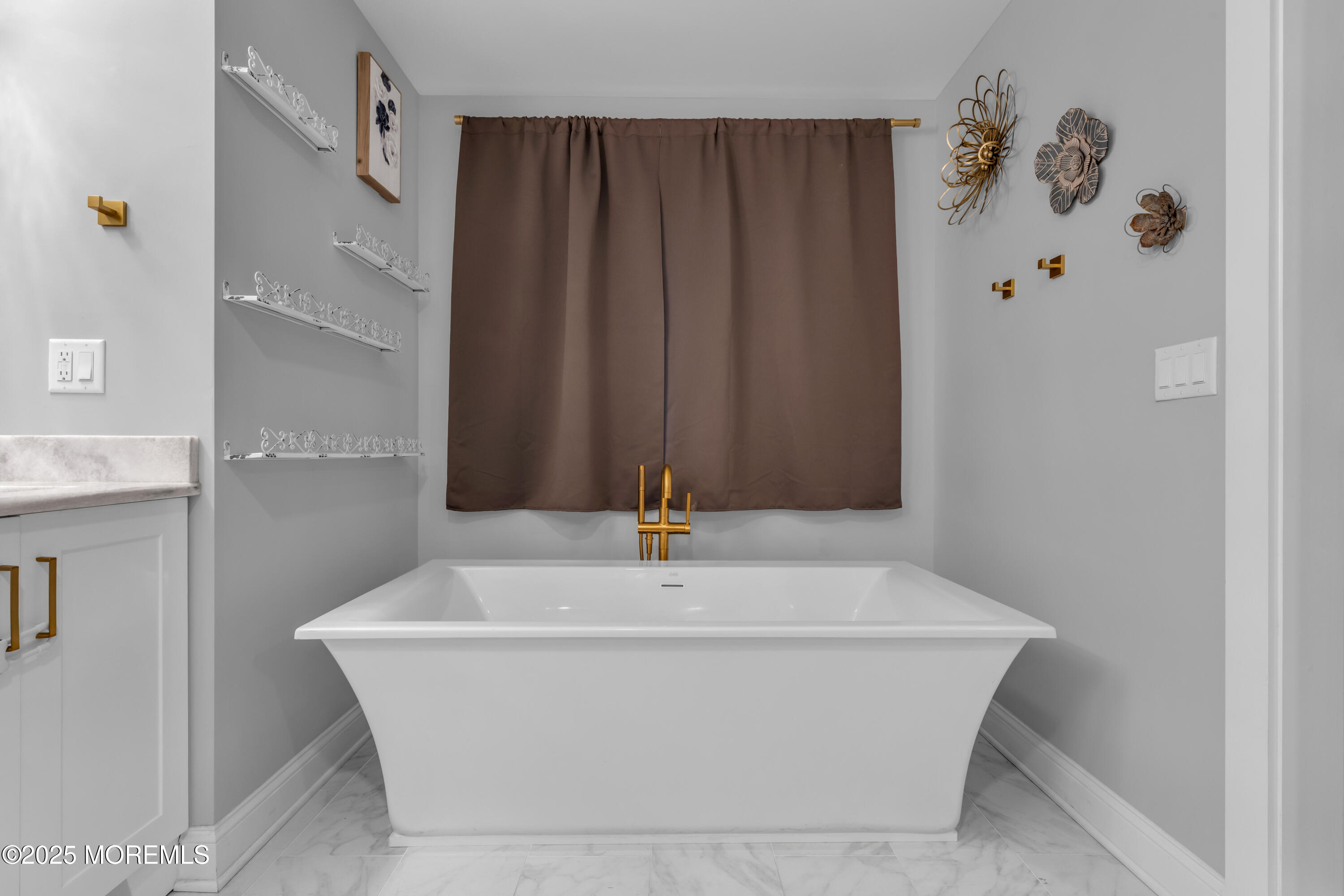 91 Sycamore Avenue Little Silver, NJ 07739 - Photo 13 of 52 a white bath tub sitting in a bathroom