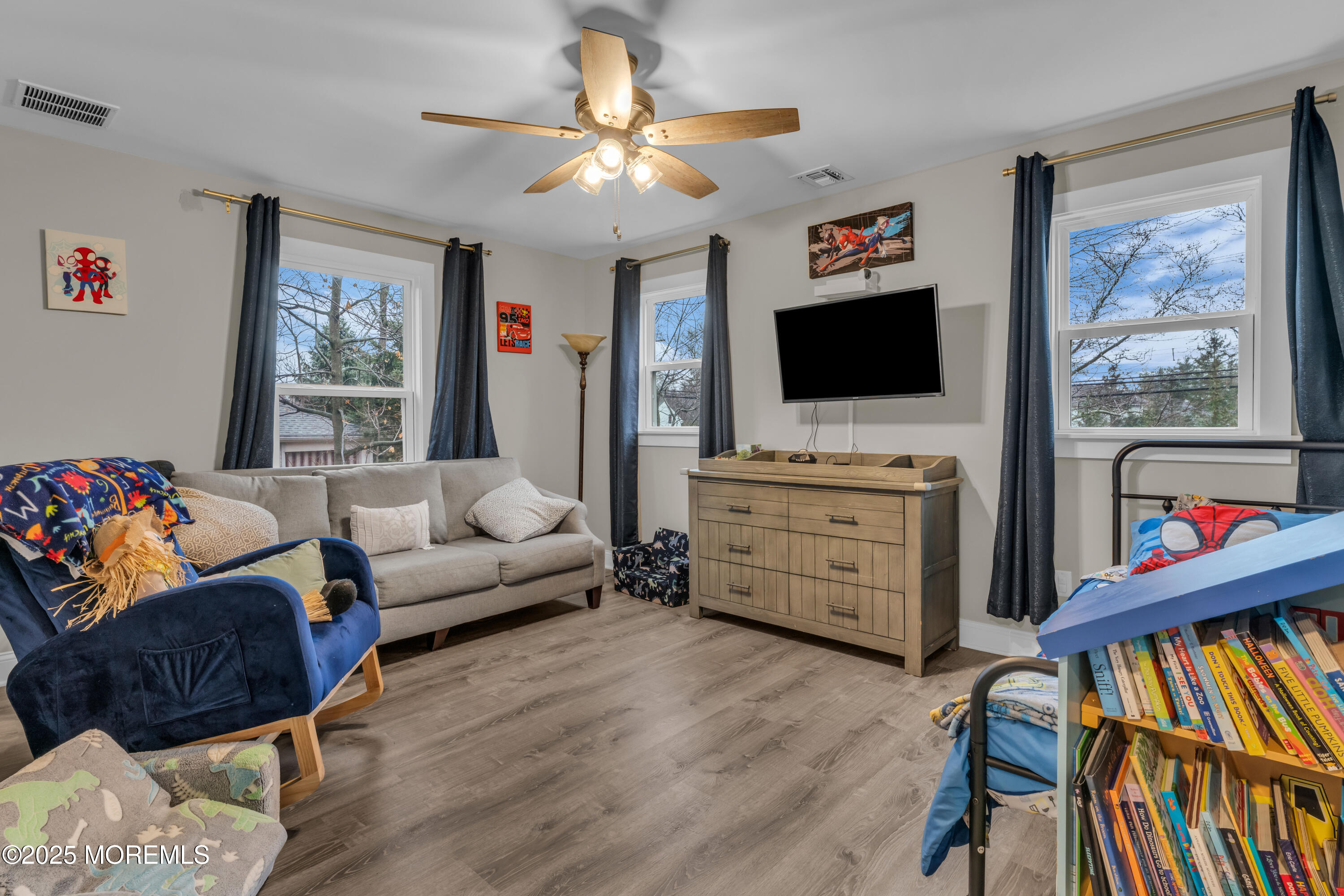 91 Sycamore Avenue Little Silver, NJ 07739 - Photo 16 of 52 a living room with furniture and a flat screen tv