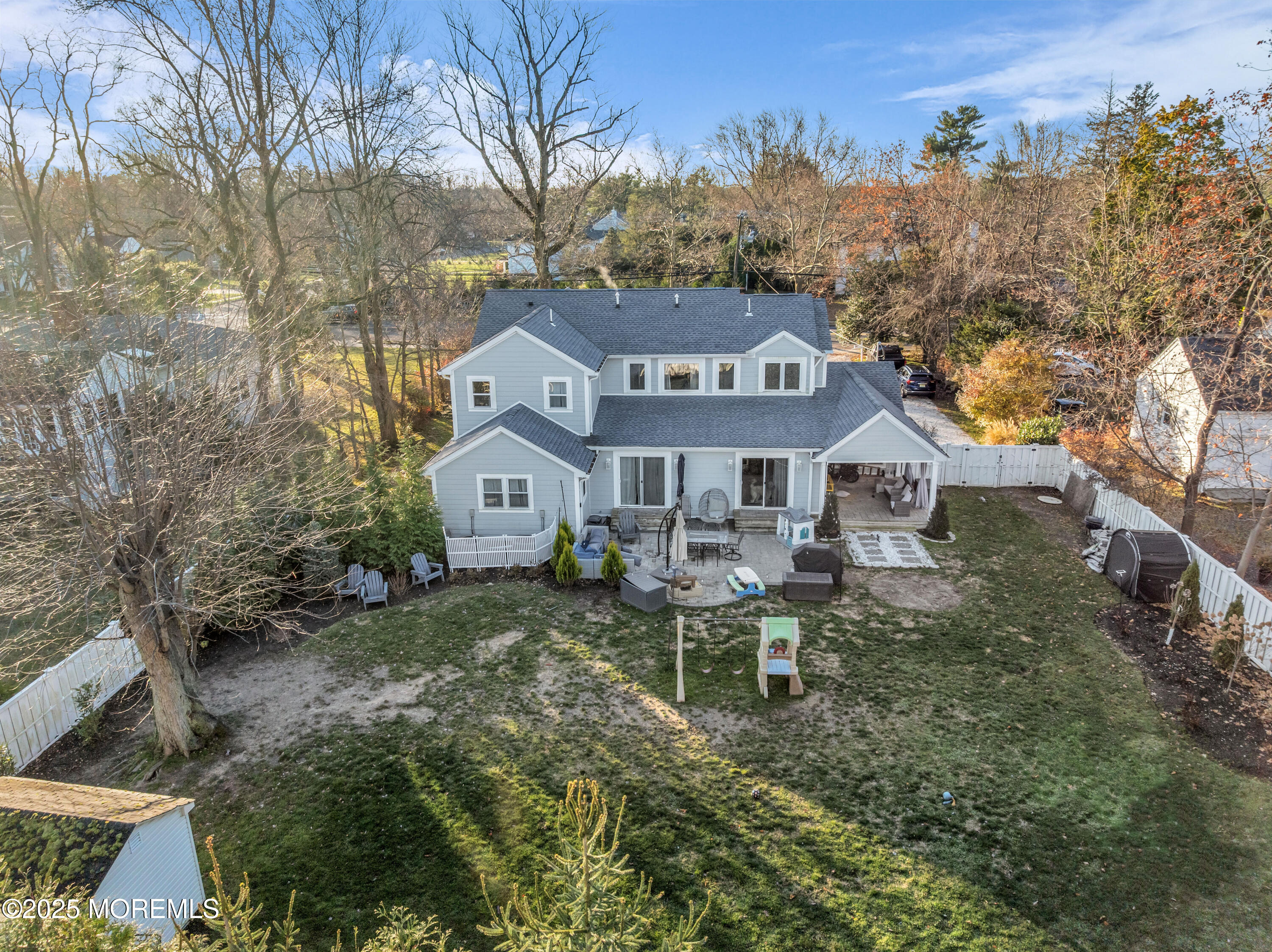 91 Sycamore Avenue Little Silver, NJ 07739 - Photo 20 of 52 a front view of a house with a yard and trees