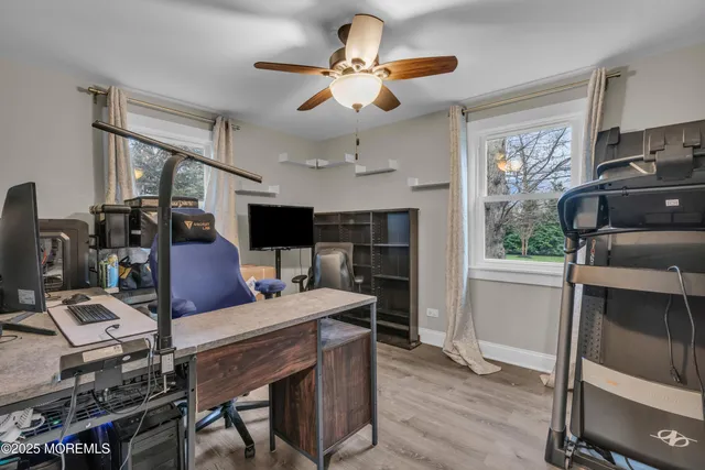a living room with furniture fireplace and window