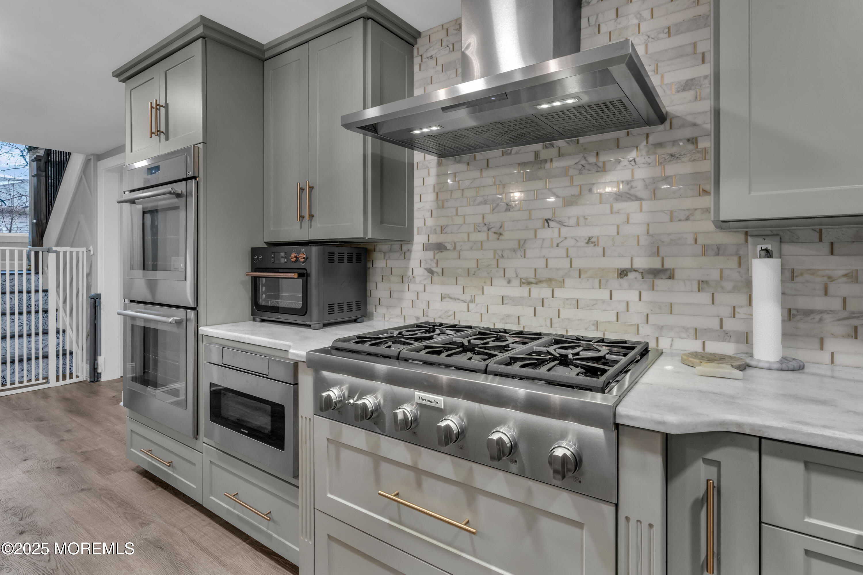 91 Sycamore Avenue Little Silver, NJ 07739 - Photo 3 of 52 a kitchen with granite countertop a stove and a sink