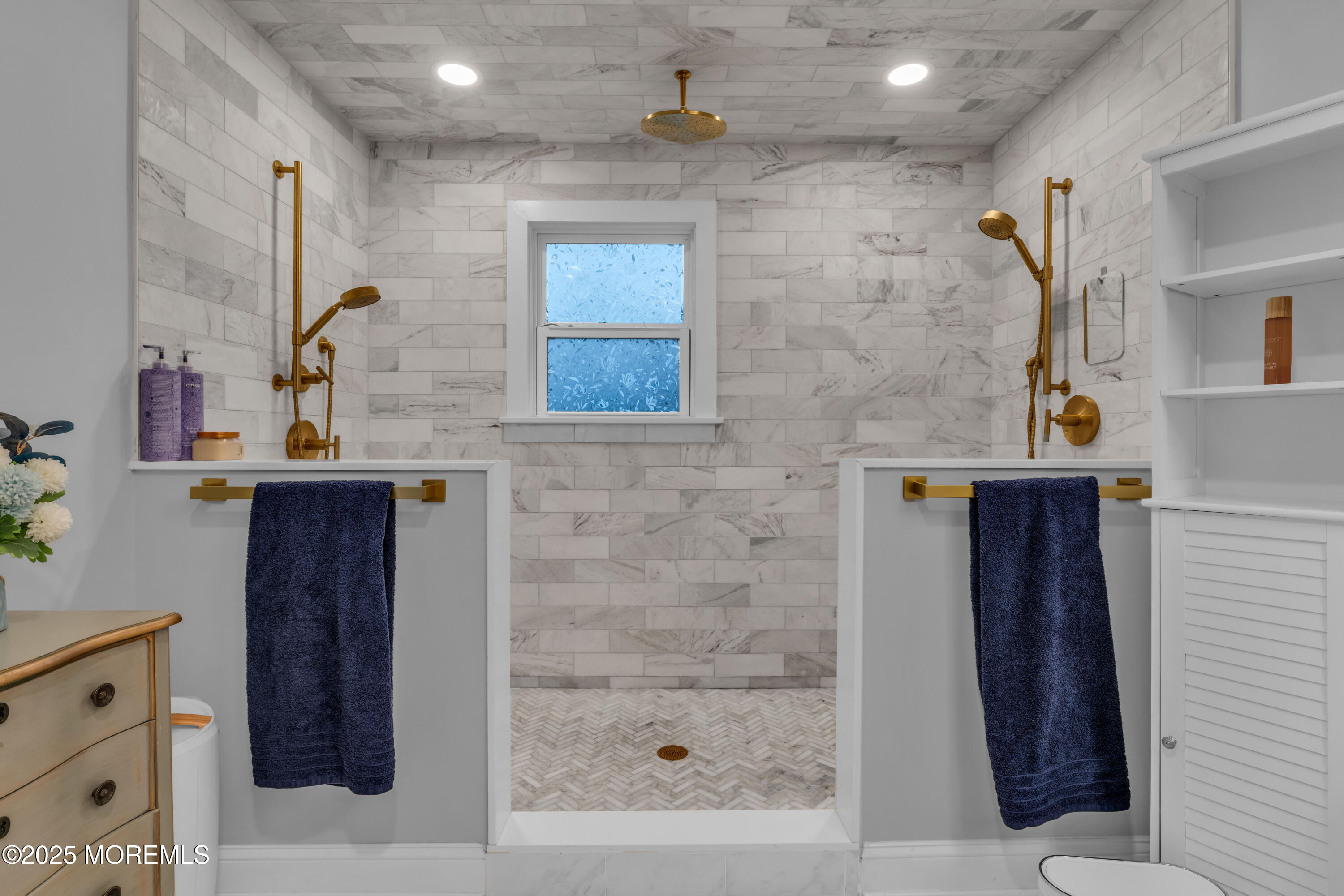 91 Sycamore Avenue Little Silver, NJ 07739 - Photo 33 of 52 a bathroom with a sink a mirror and shower