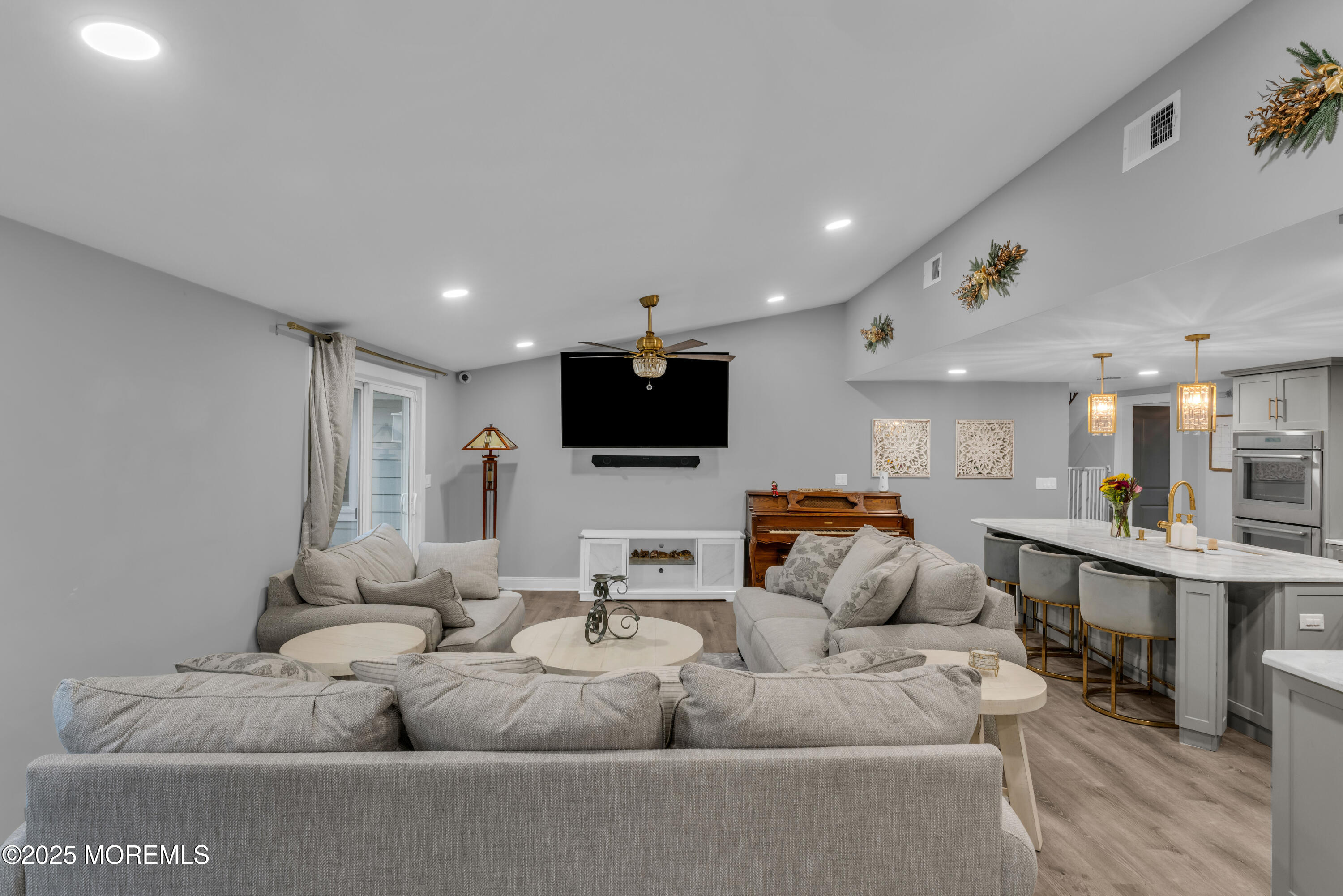 91 Sycamore Avenue Little Silver, NJ 07739 - Photo 37 of 52 a living room with furniture and a flat screen tv