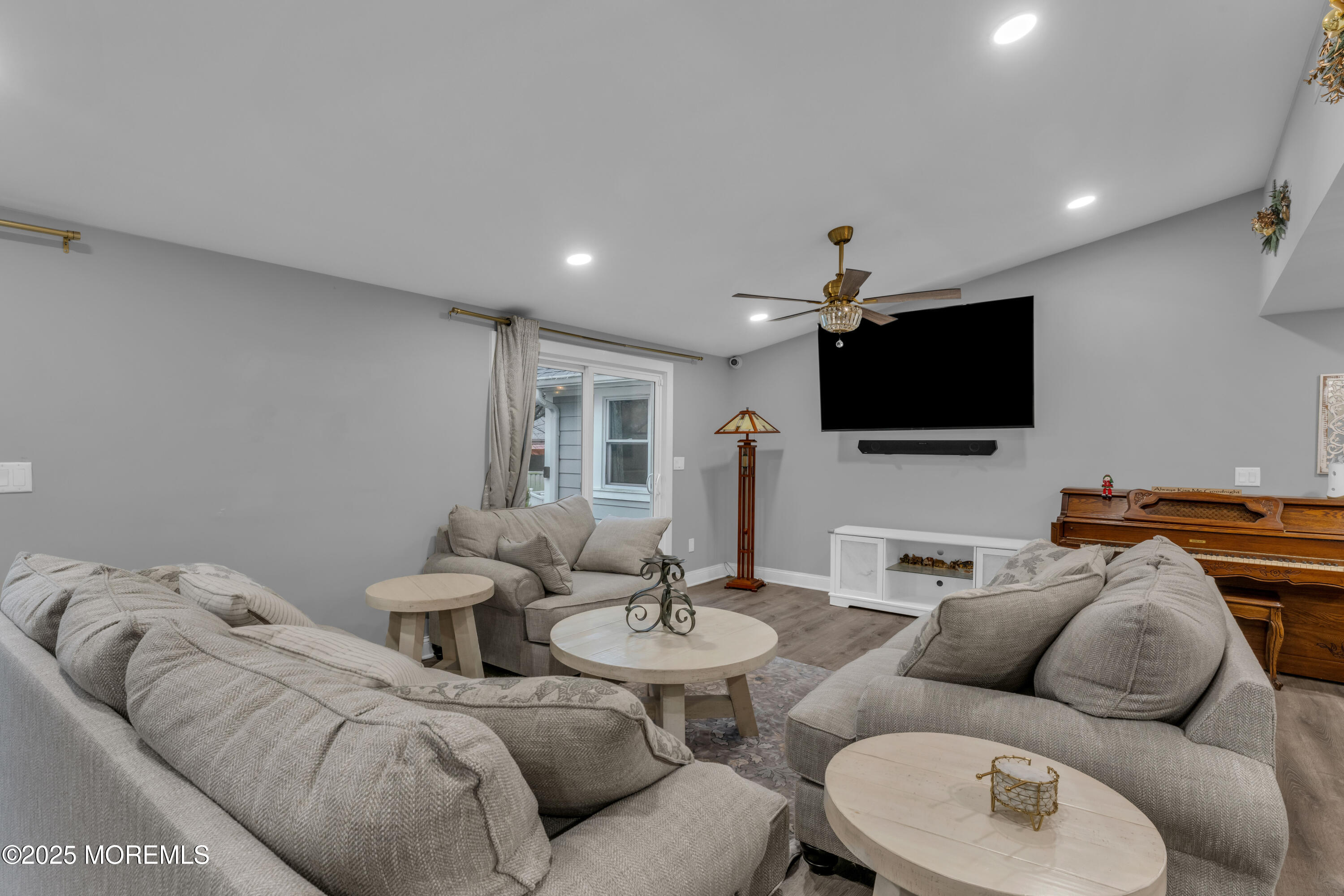 91 Sycamore Avenue Little Silver, NJ 07739 - Photo 39 of 52 a living room with furniture and a flat screen tv